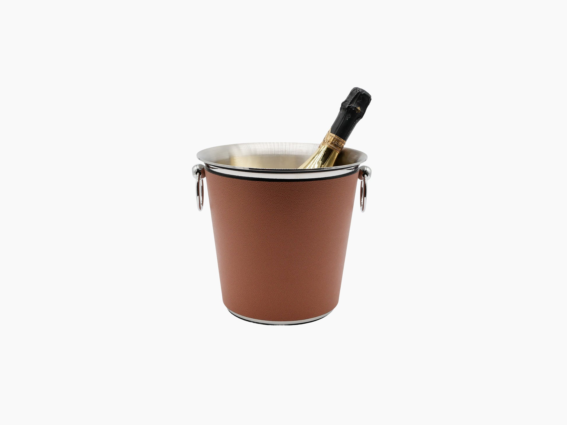 Brown leather champagne bucket with a silver rim and side handles holding a bottle