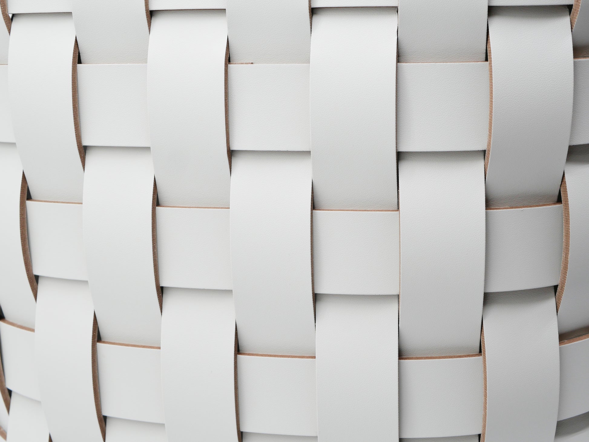 Close up of pale gray woven panels on the Demetra Paper Bin