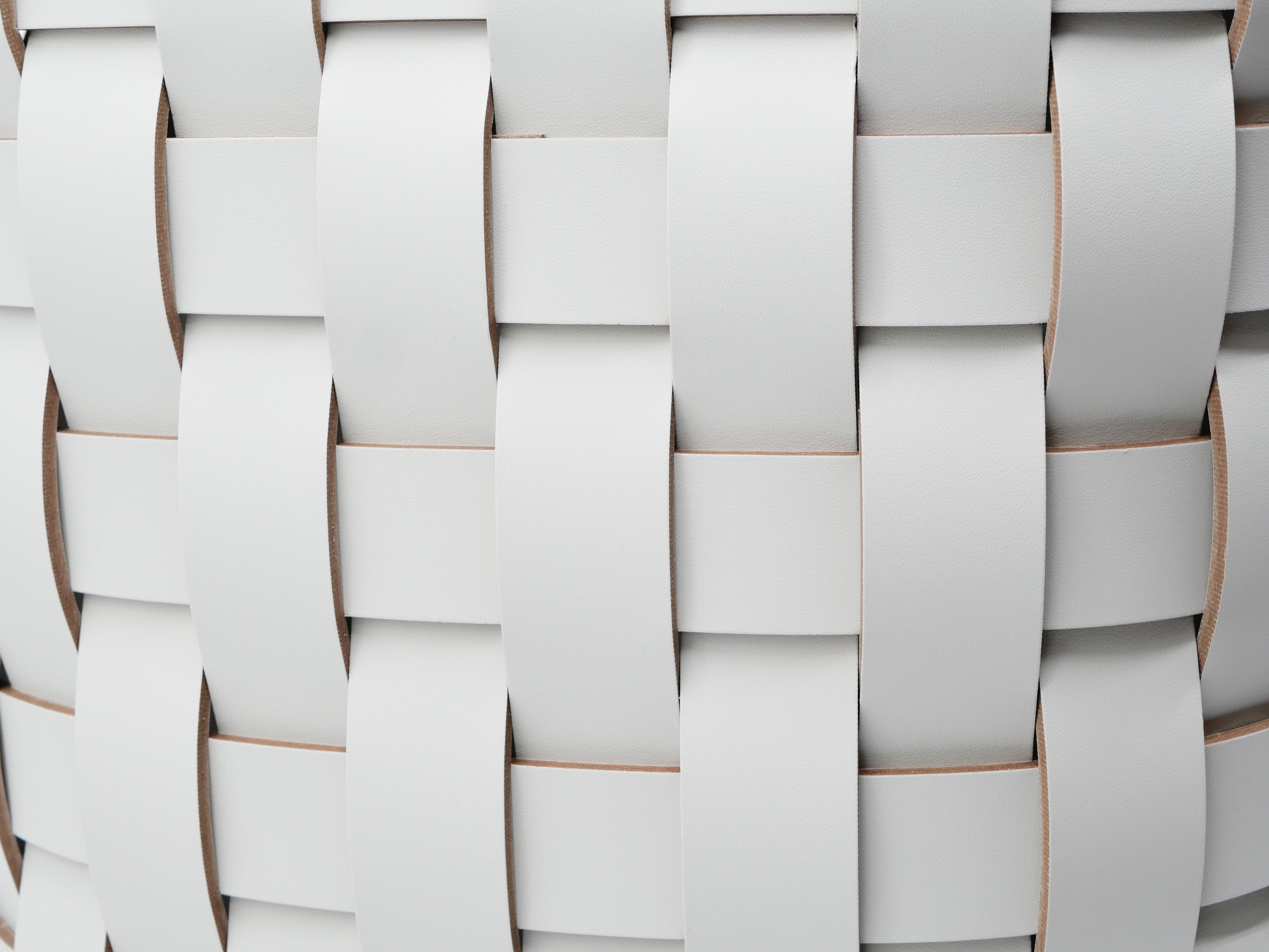Close up of pale gray woven panels on the Demetra Paper Bin
