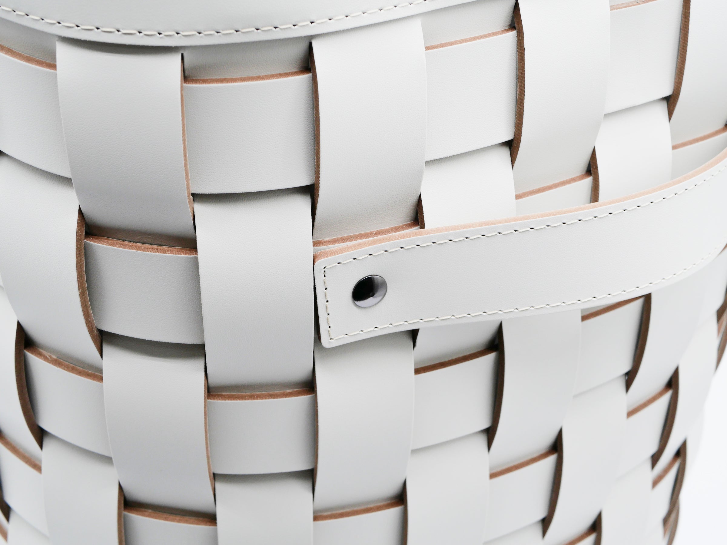 Close up detail of light gray Demetra Paper Bin showing stitched strap and edge detail