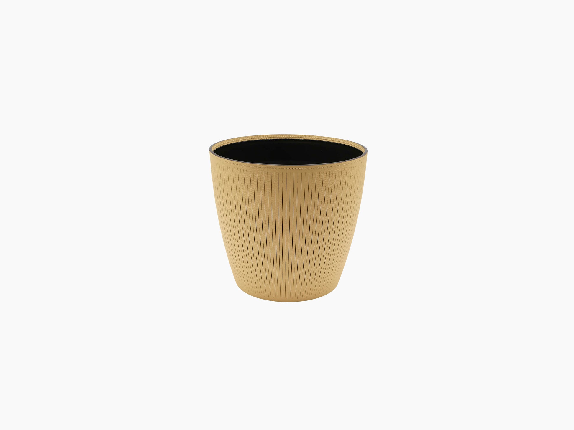 Medium Silvy Flower Pot in tan with a black interior and vertical pattern.
