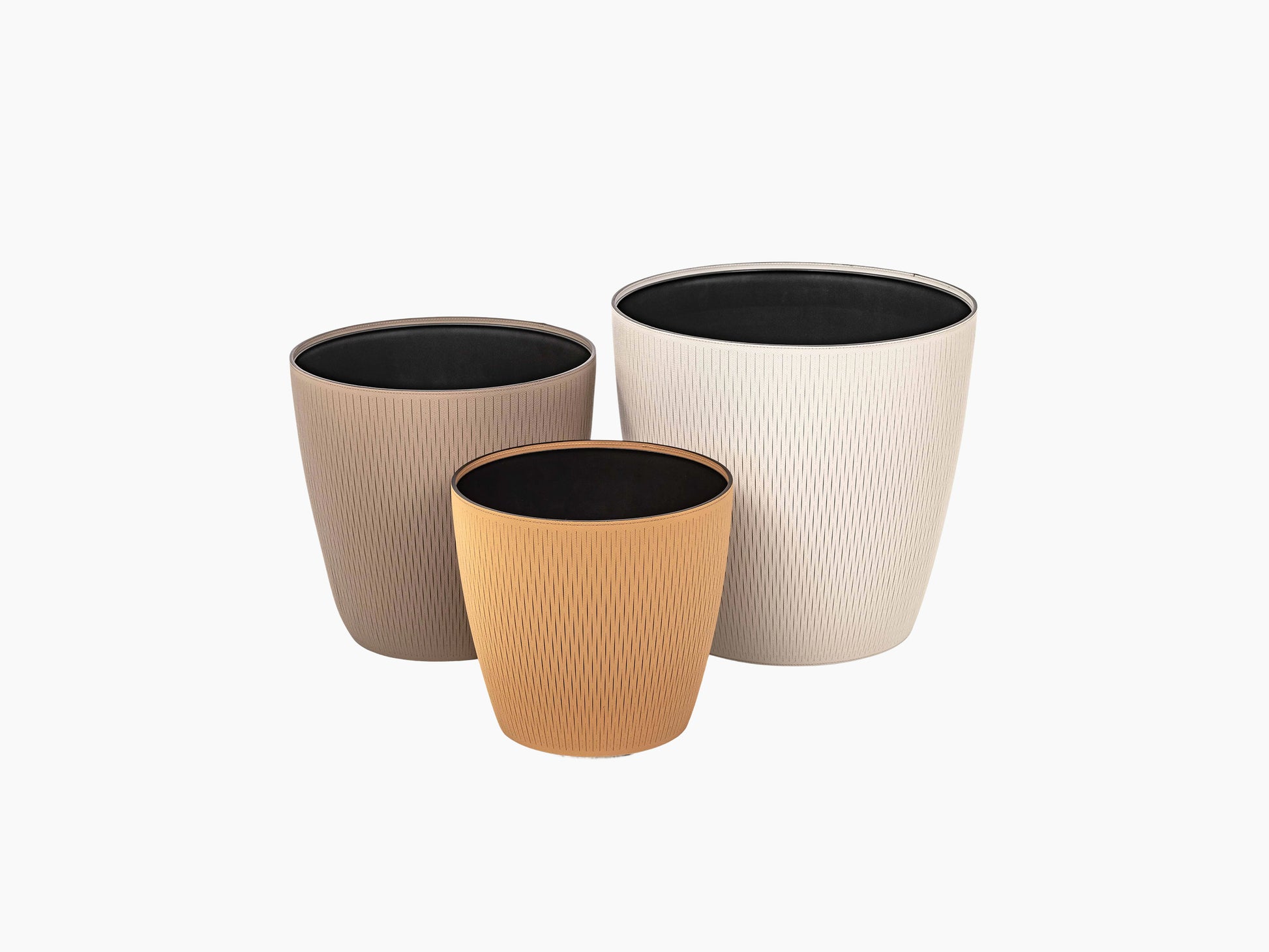 Set of three Silvy flower pots in taupe beige and terracotta with a subtle vertical pattern and black interiors