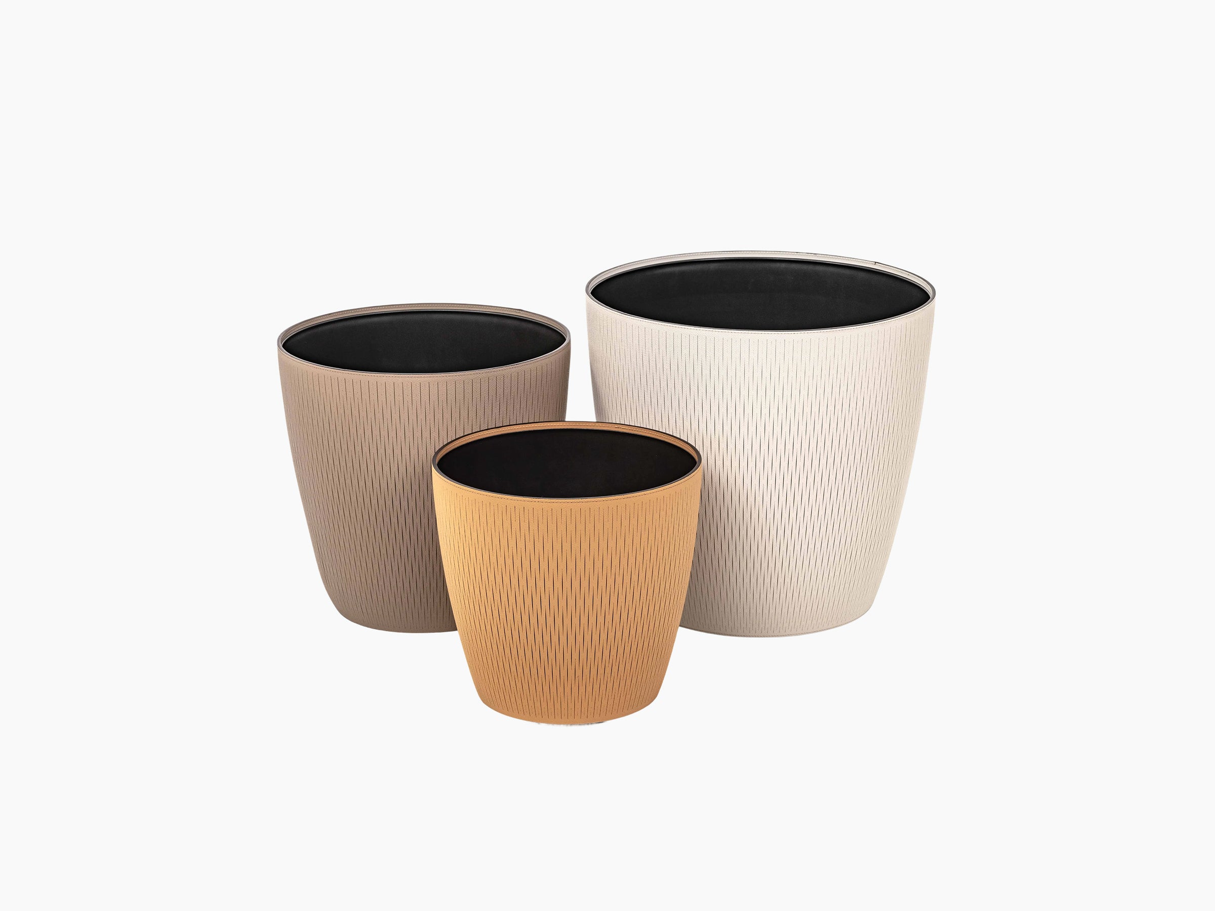 Set of three Silvy flower pots in taupe beige and terracotta with a subtle vertical pattern and black interiors