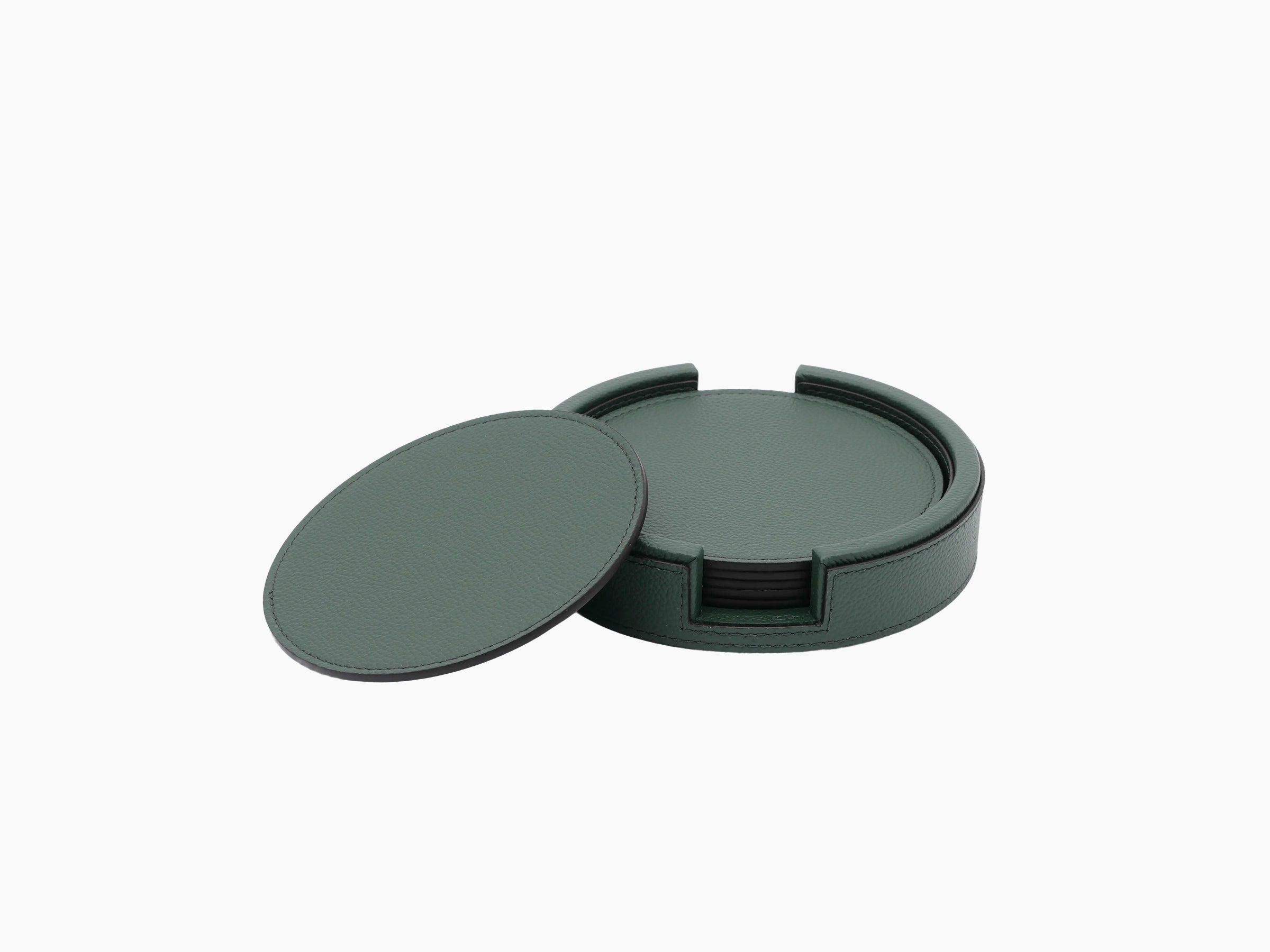 Open round green leather coaster holder with lid removed and six coasters inside