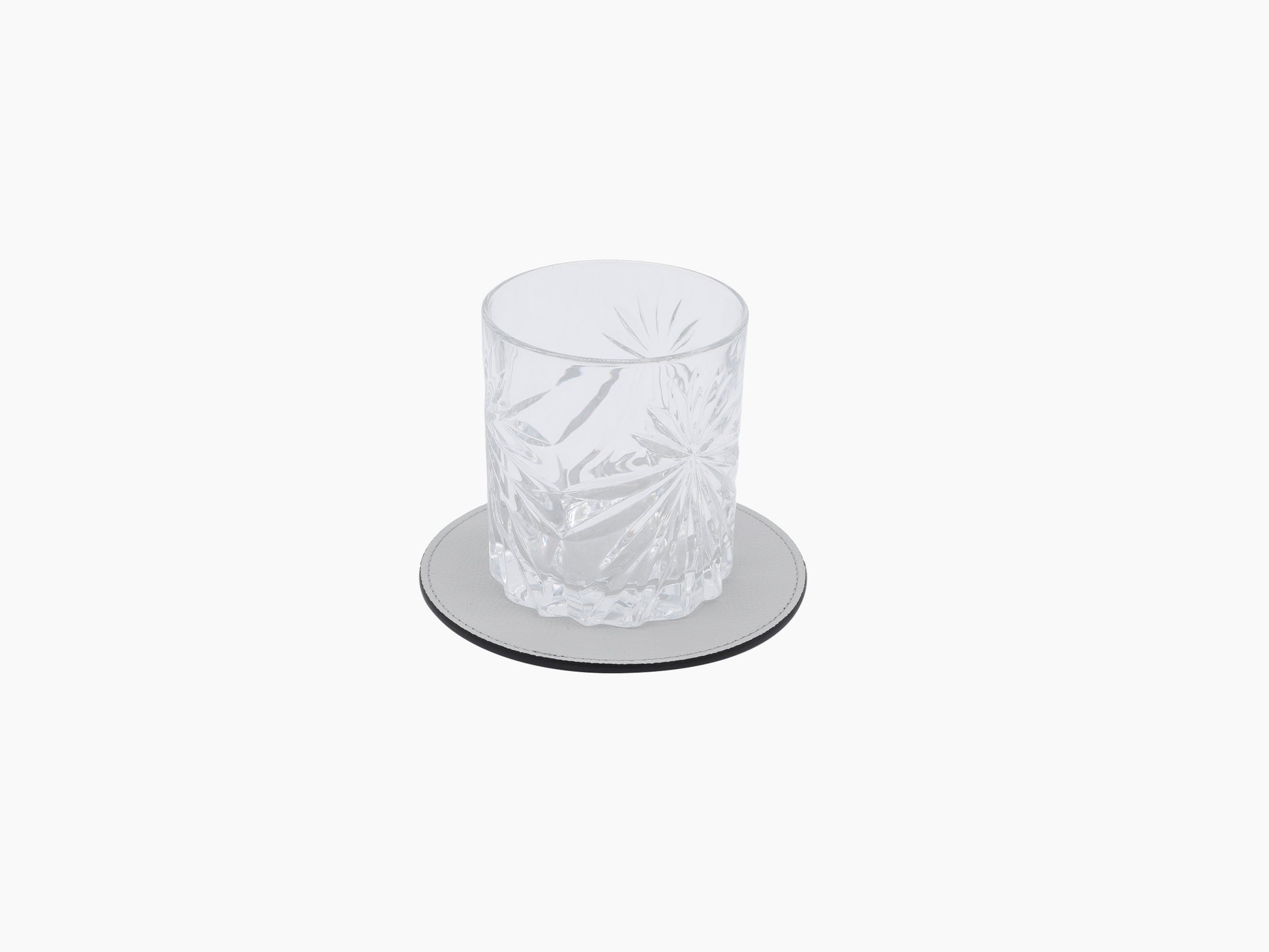 Round light gray leather coaster holder with stitched edge