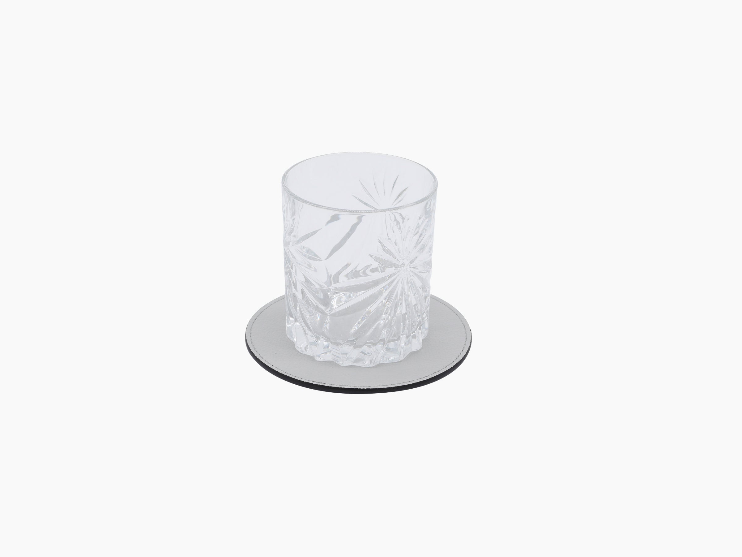 Round light gray leather coaster holder with stitched edge