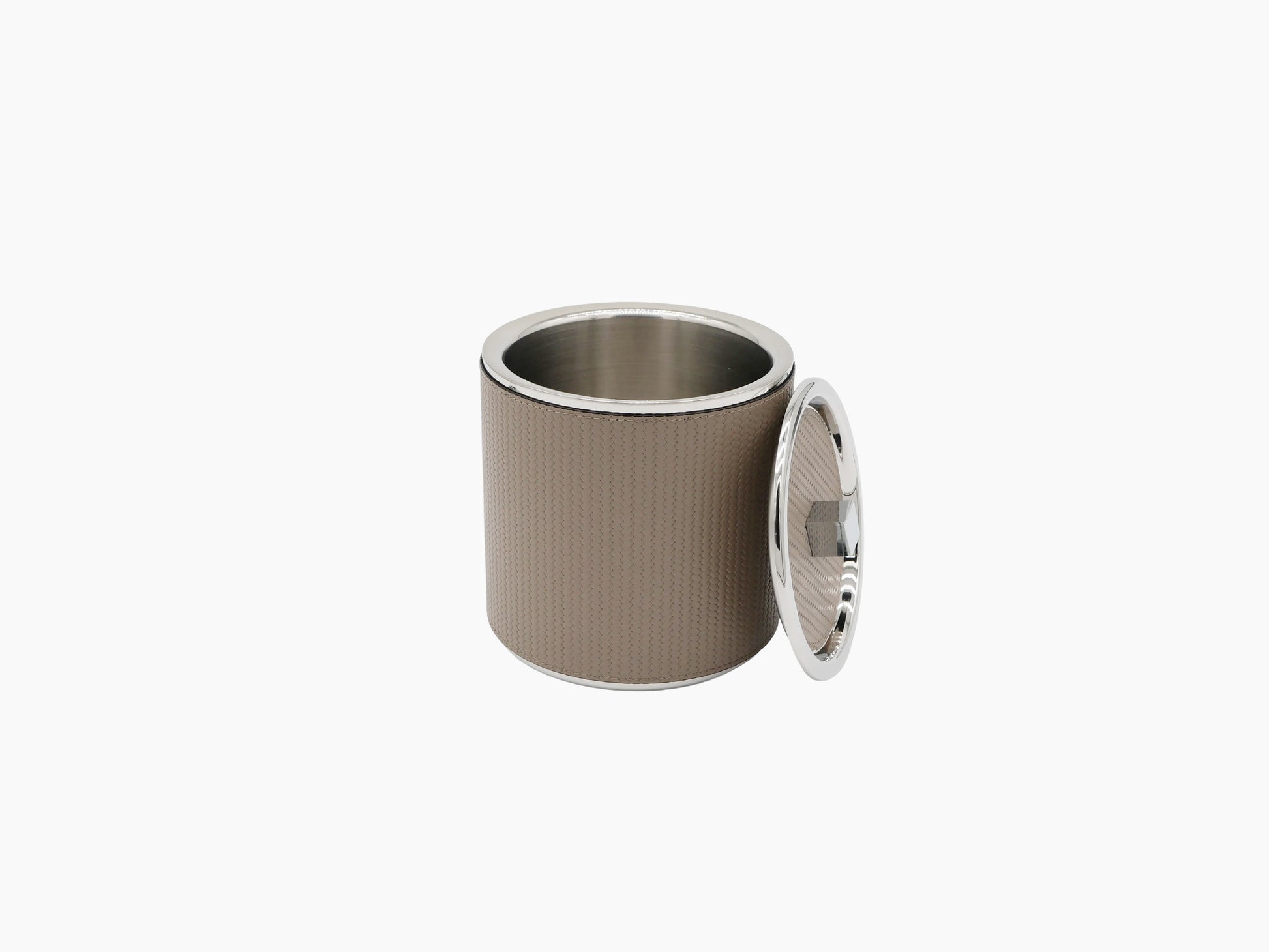 Brown leather wrapped ice bucket with chrome rim and a lid leaning against the bucket.