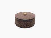 Brown leather Lily Big Round Box with herringbone embroidery and a gold knob on the lid.