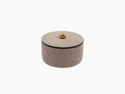 Lily Medium Round Box in taupe leather with herringbone embroidery and a gold finial lid