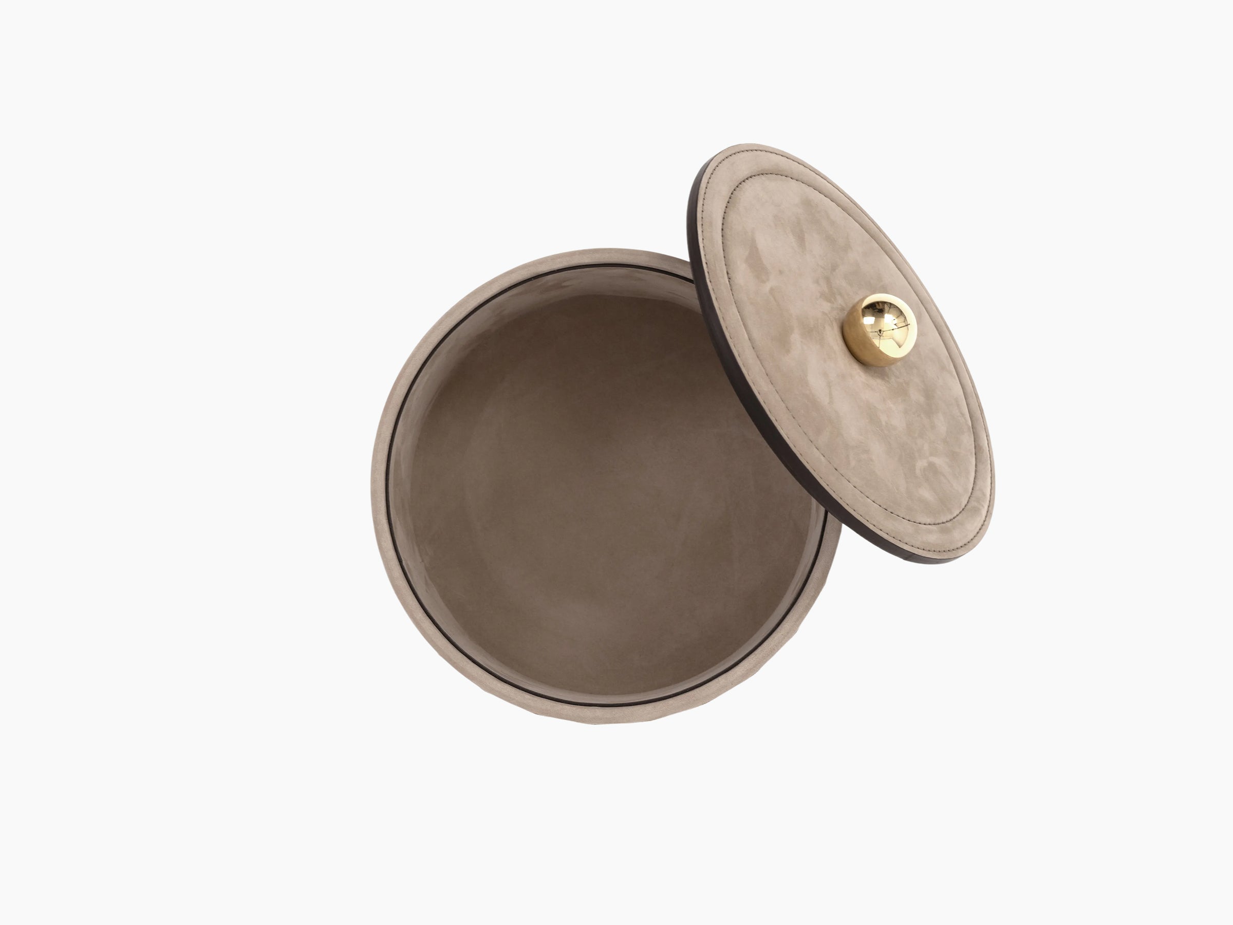 Taupe leather Lily Medium Round Box with a gold knob lid slightly ajar.