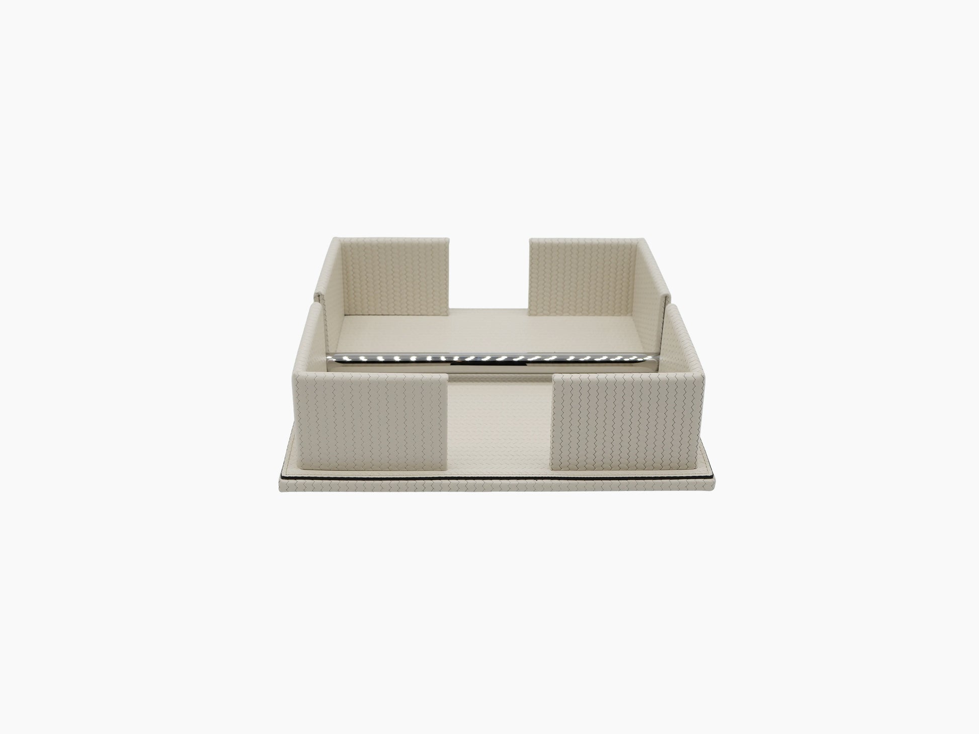 Cream leather napkin holder with a weighted chrome bar along the front edge