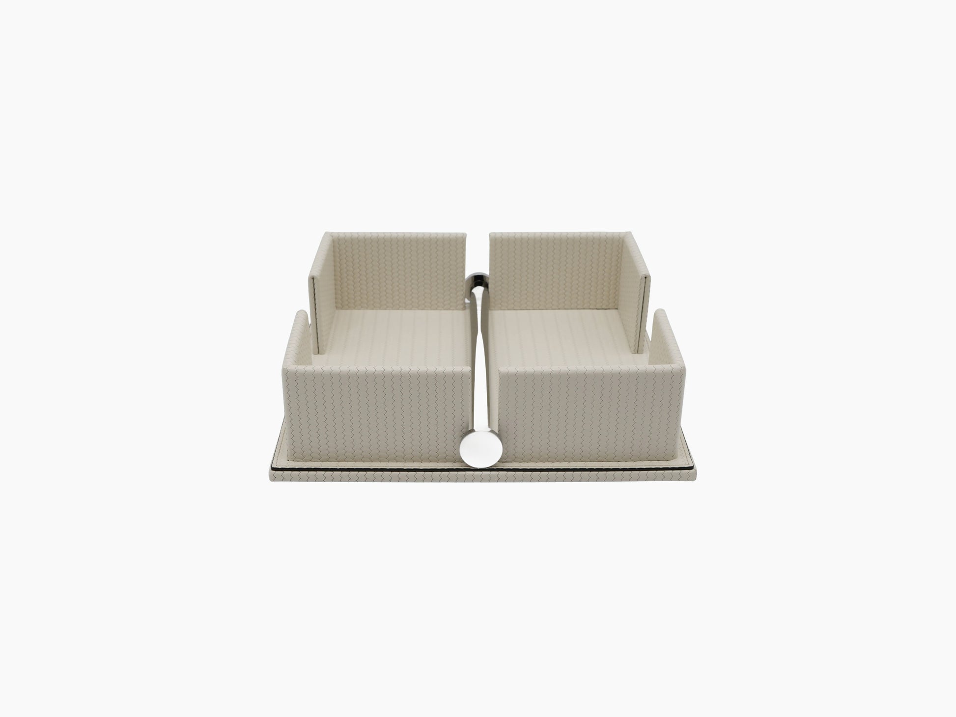 Beige leather napkin holder with a weighted chrome bar across the opening
