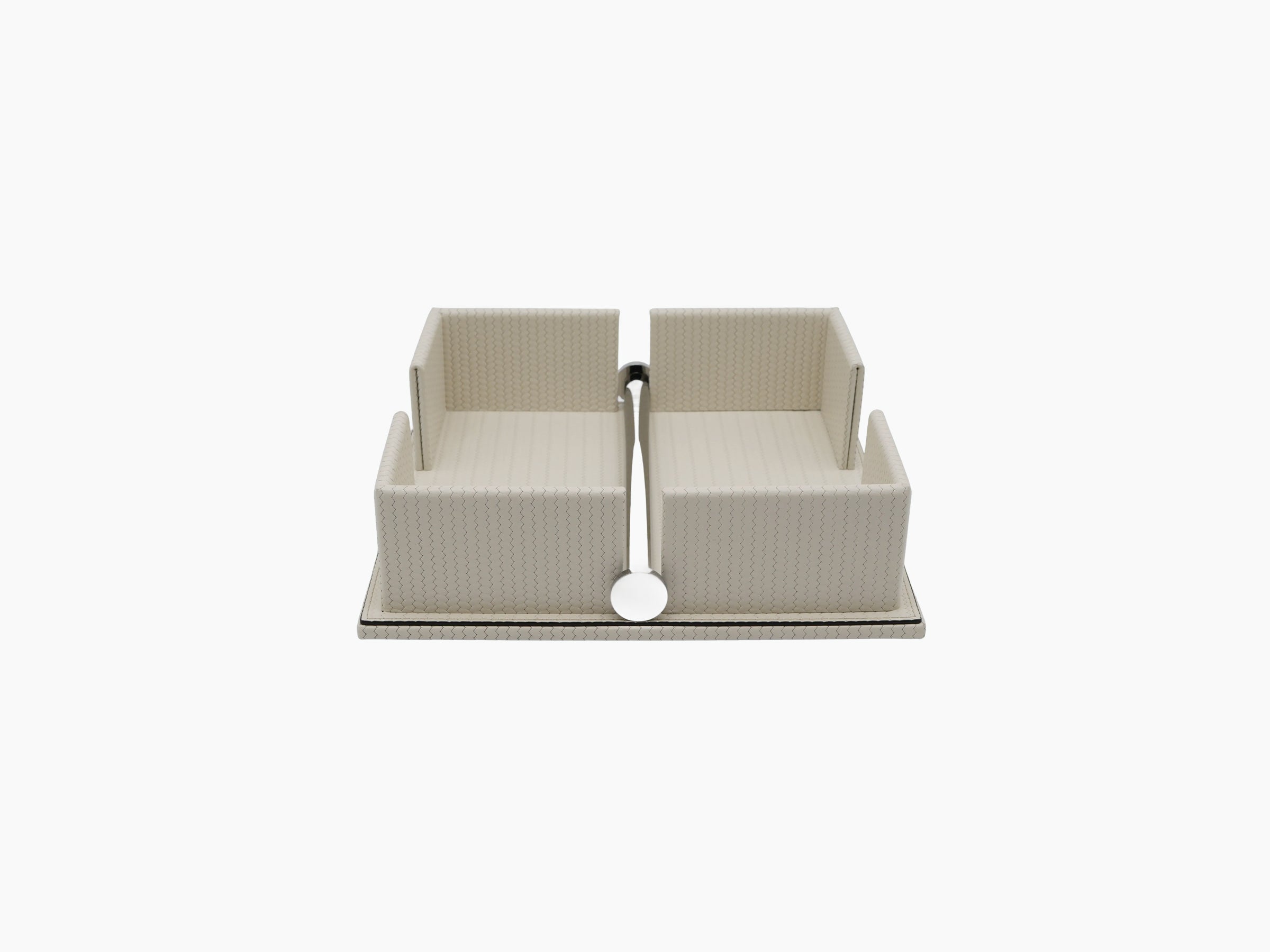 Beige leather napkin holder with a weighted chrome bar across the opening