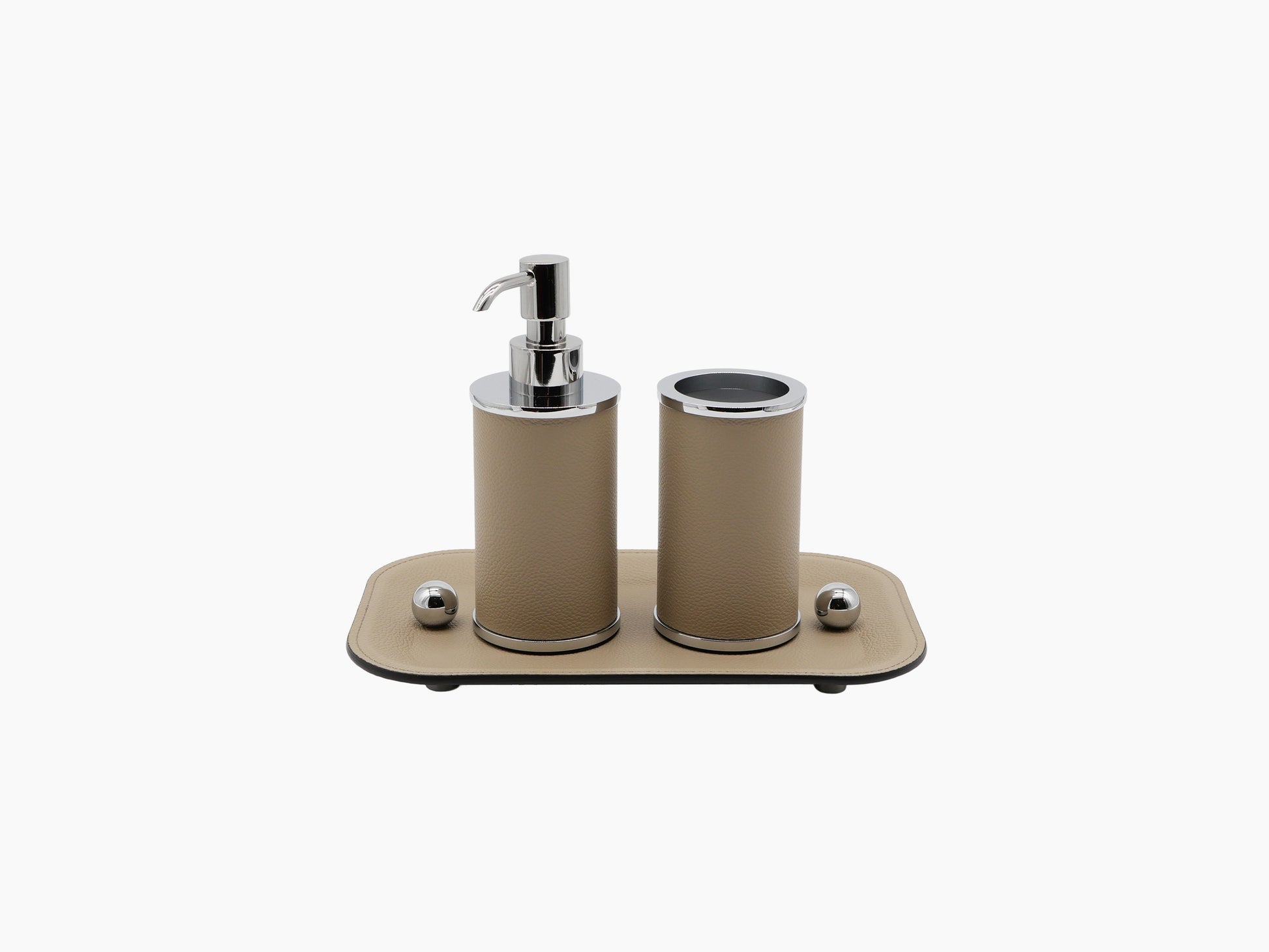Small Olimpia beige leather rectangular tray holding two cylindrical containers with chrome trim and a pump dispenser.