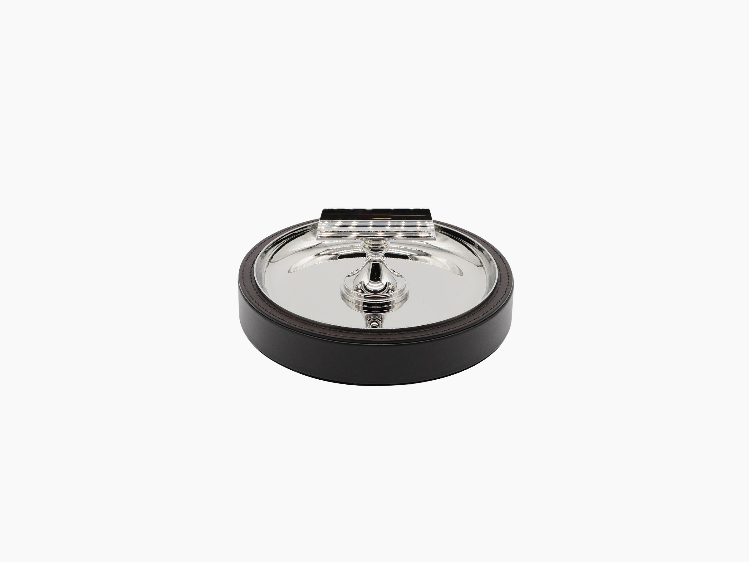 Sigaro Ashtray with a polished steel bowl and demi lune holder atop a dark wood base with leather edge