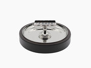 Sigaro Ashtray with a polished steel bowl a demi lune holder and leather trim on a dark wood base