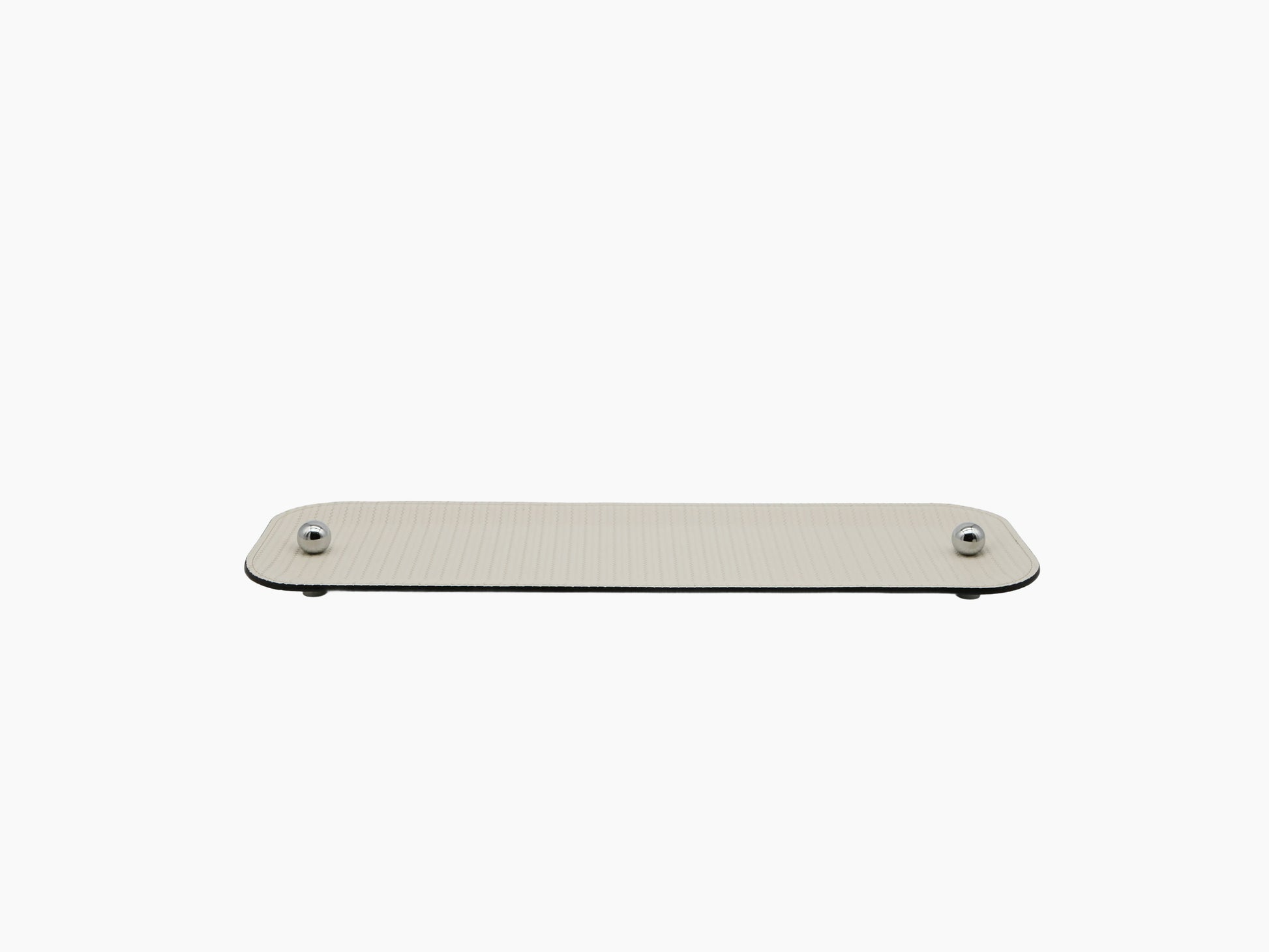 Olimpia Tray in beige leather with rounded ends and chrome spheres at each end.