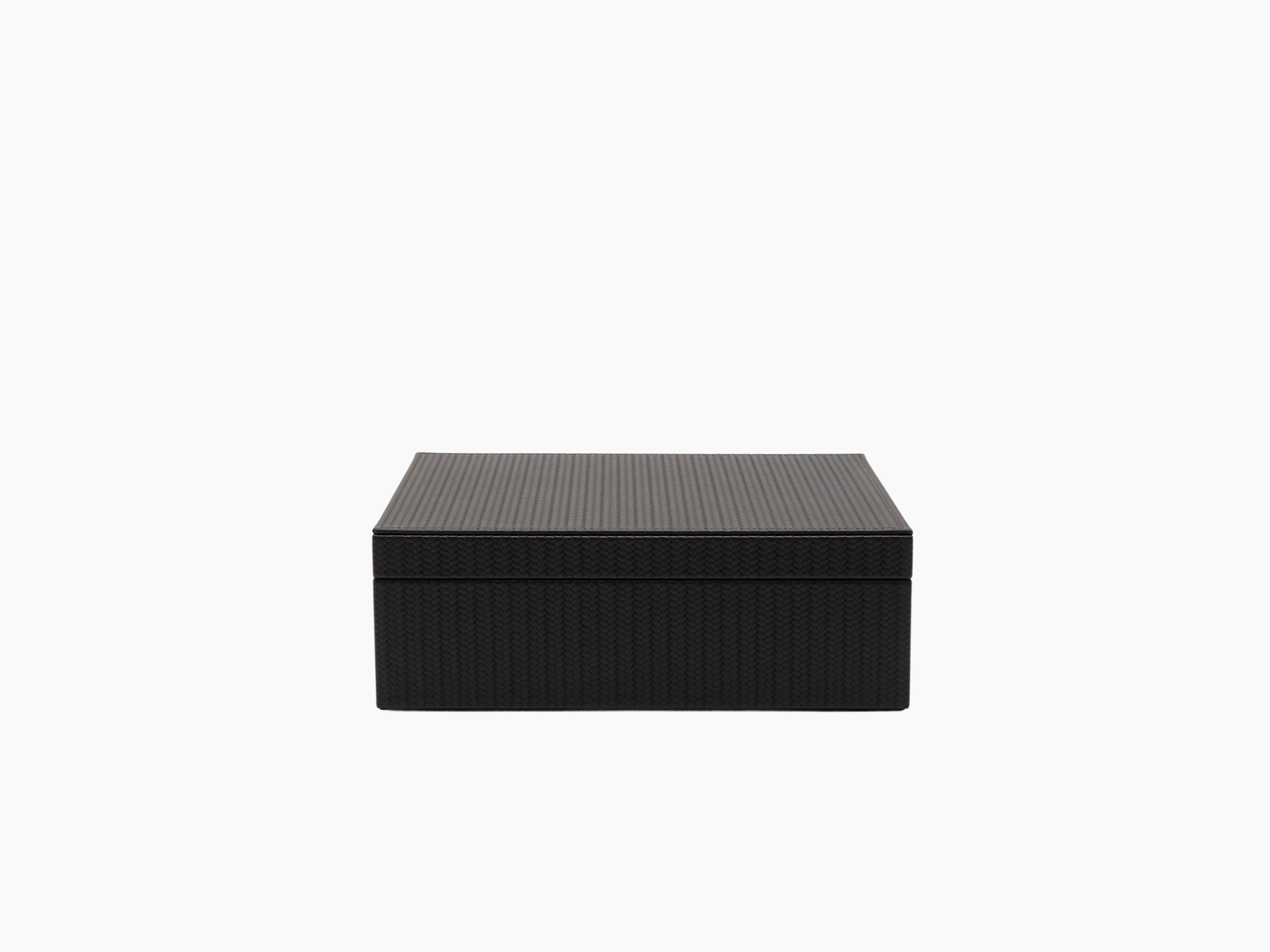 Rectangular dark woven leather tea storage box with lid closed.
