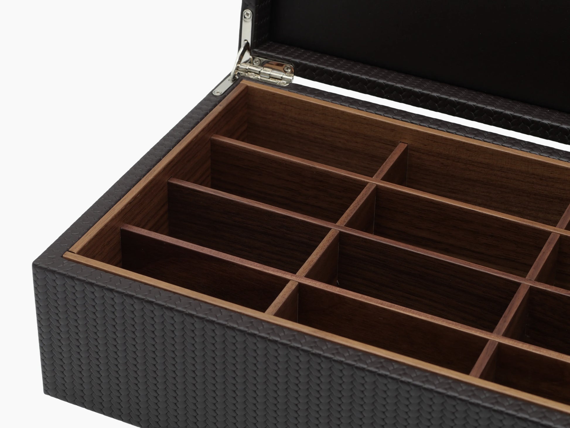 Open dark woven leather tea storage box showing twelve wooden compartments.