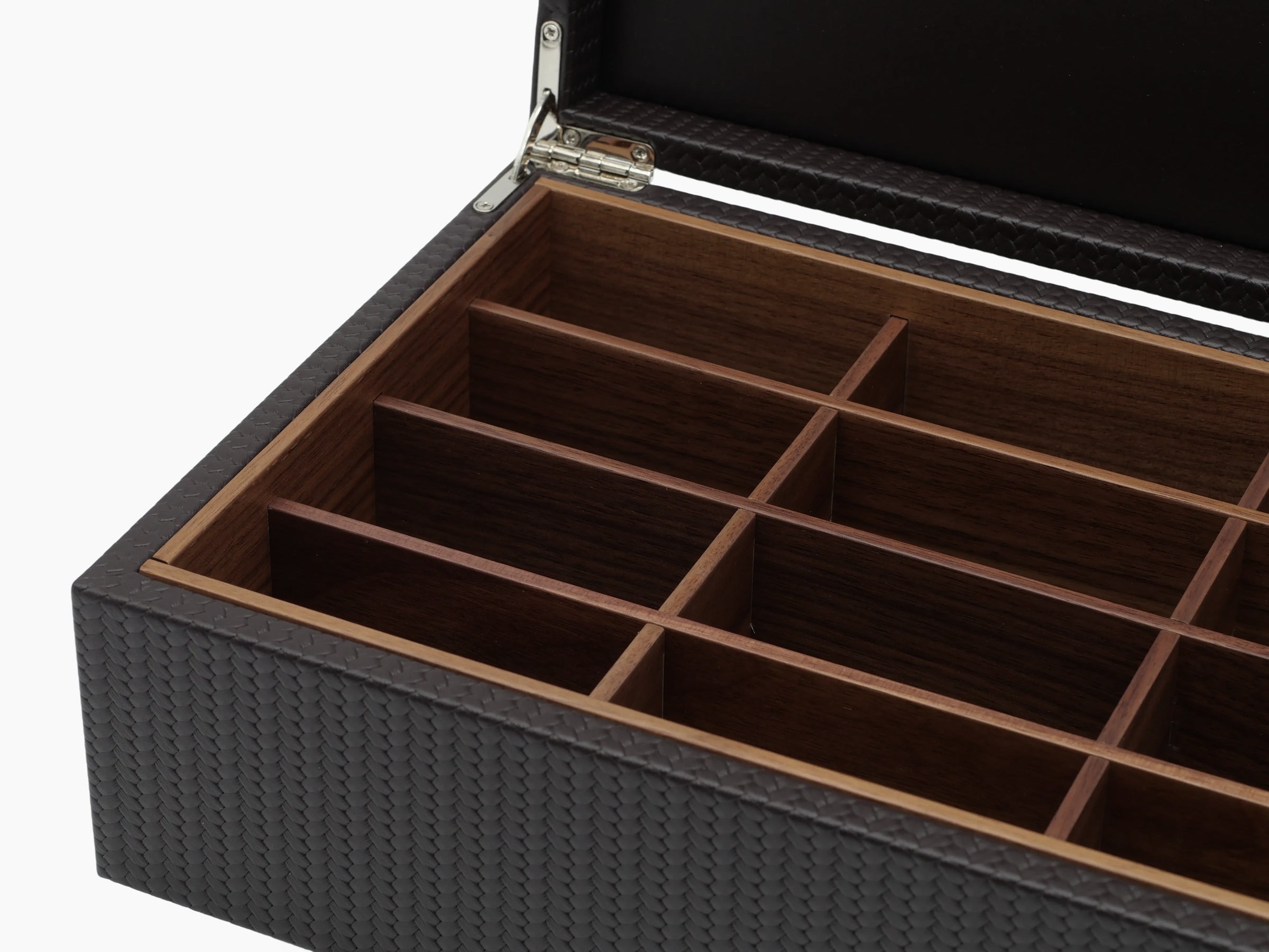 Open dark woven leather tea storage box showing twelve wooden compartments.