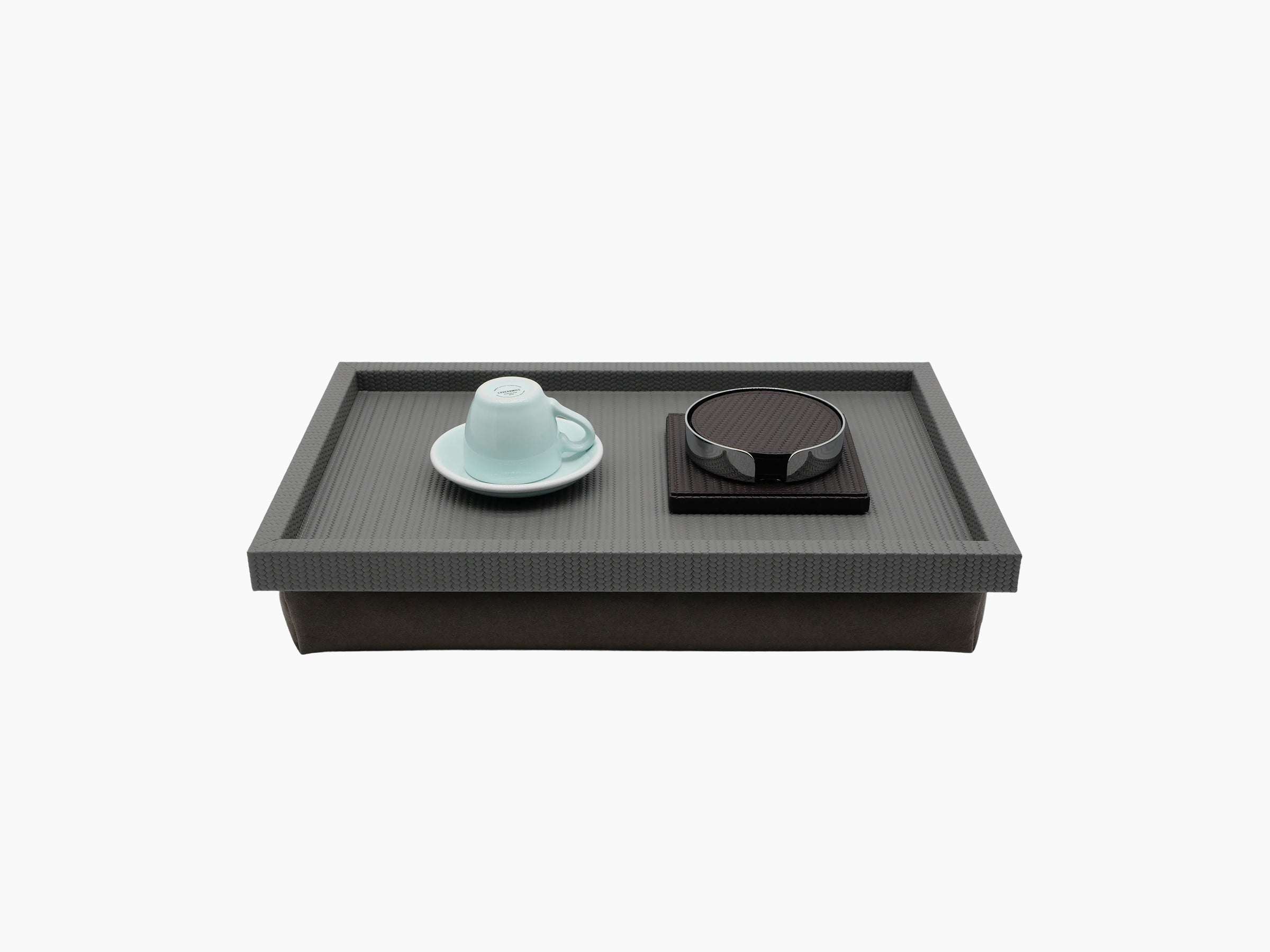 Teseo Bed Tray shown on a neutral backdrop with a blue teacup and saucer and a round dark accessory.