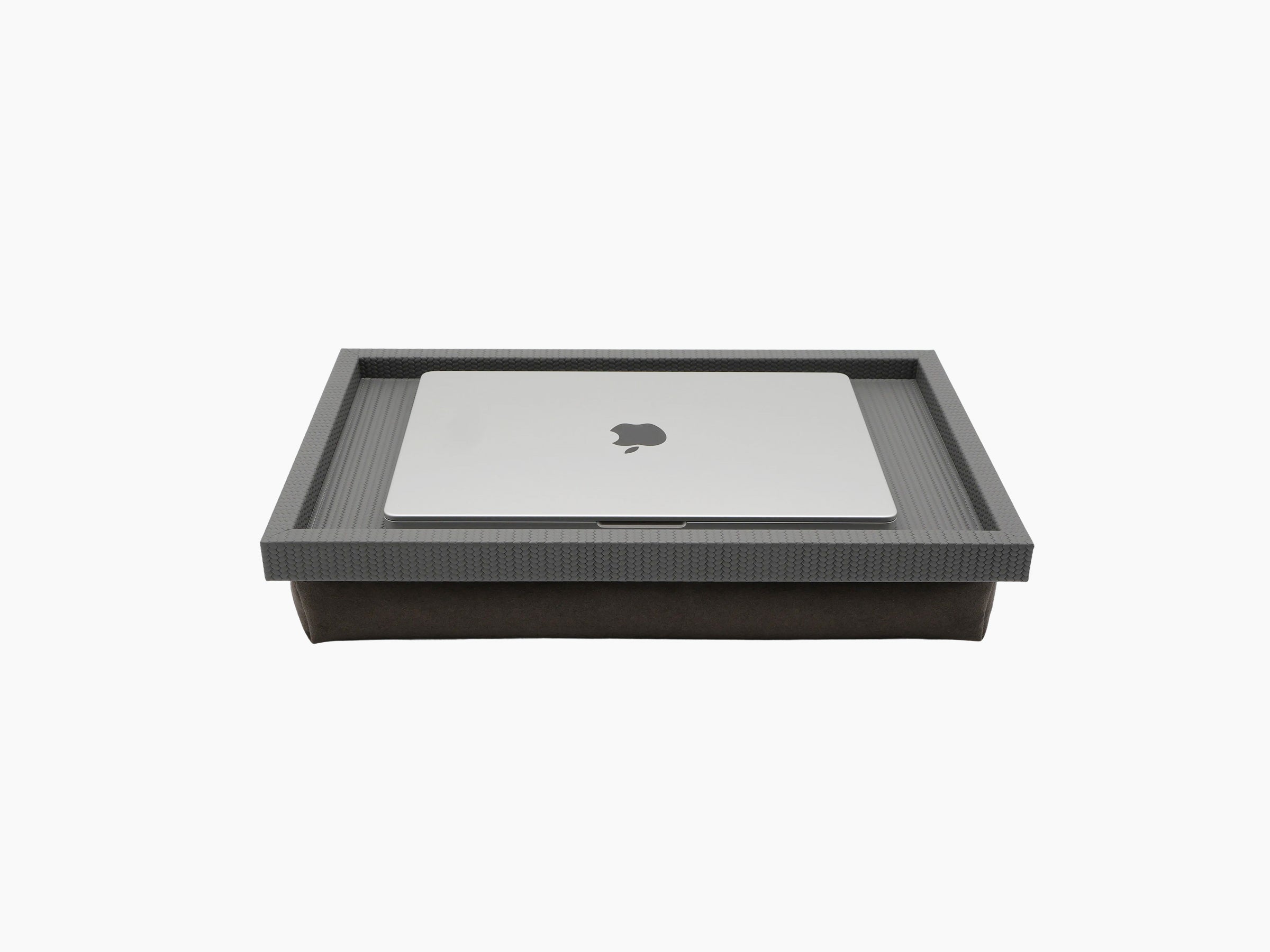 Teseo Bed Tray with laptop resting on its textured gray frame over a suede base