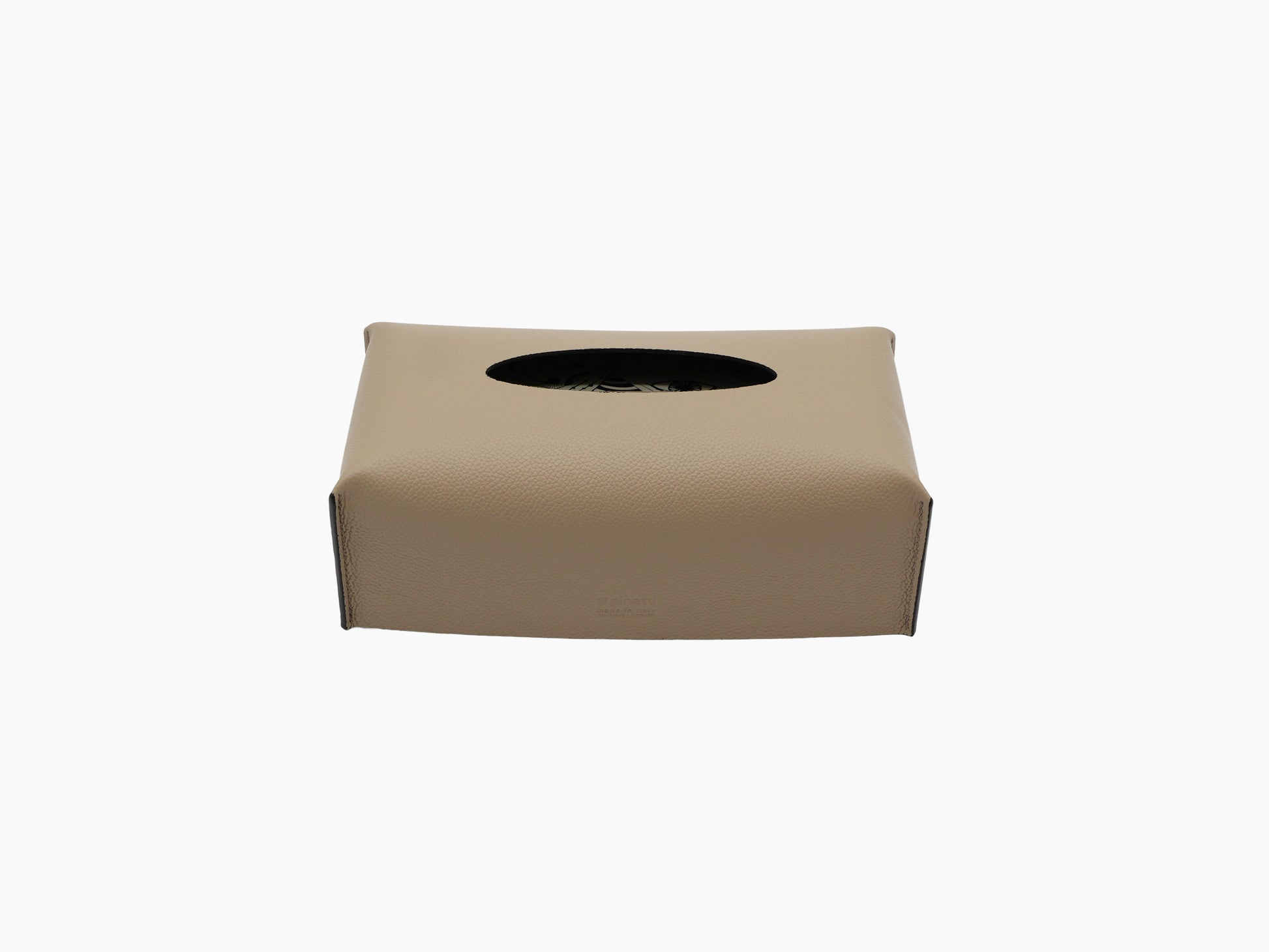 Leather wrapped rectangular tissue box with oval top opening and subtle imprint on the front