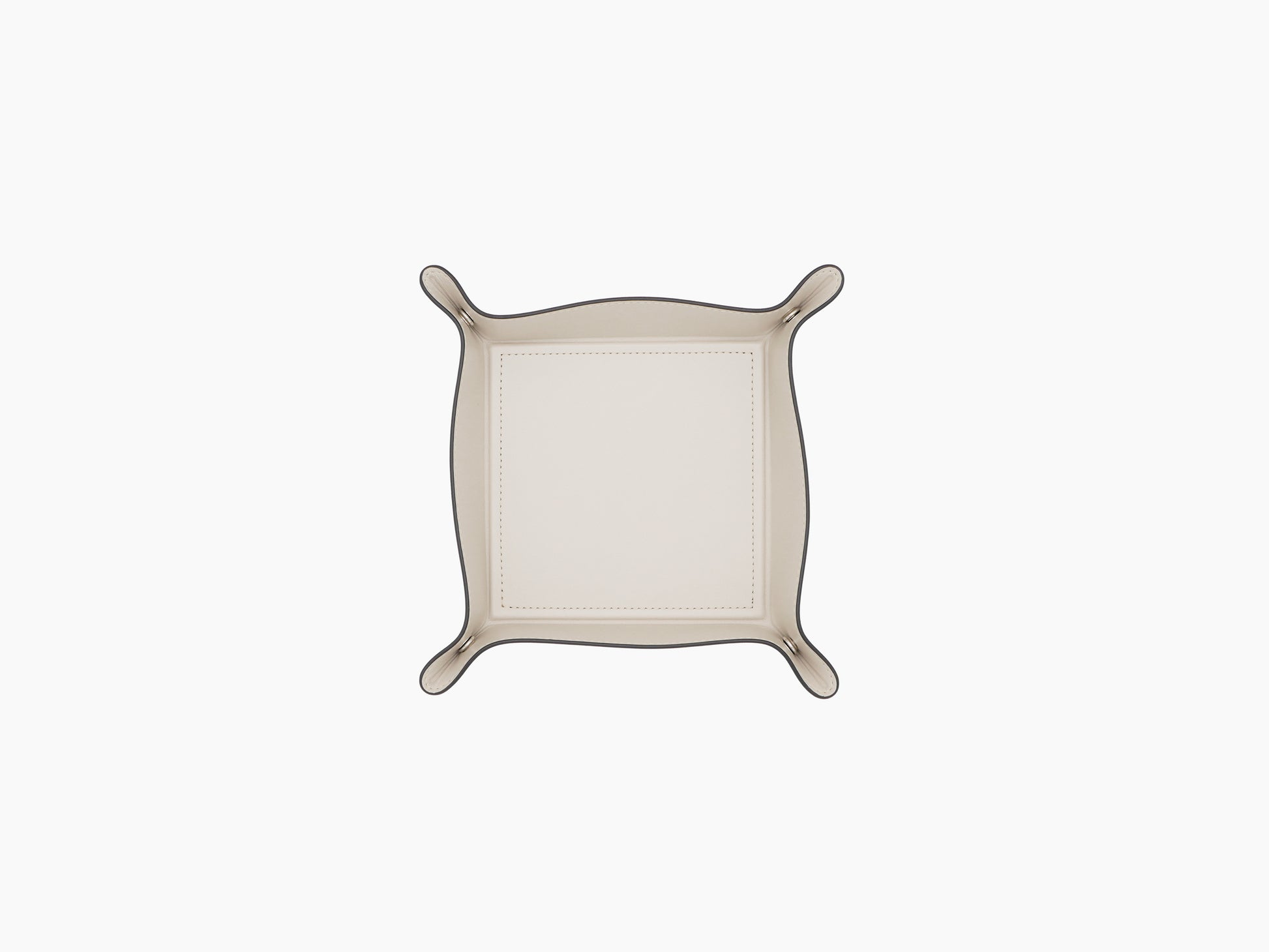 Top-down view of cream leather Square Trinket Small Tray with gold-tone corner studs