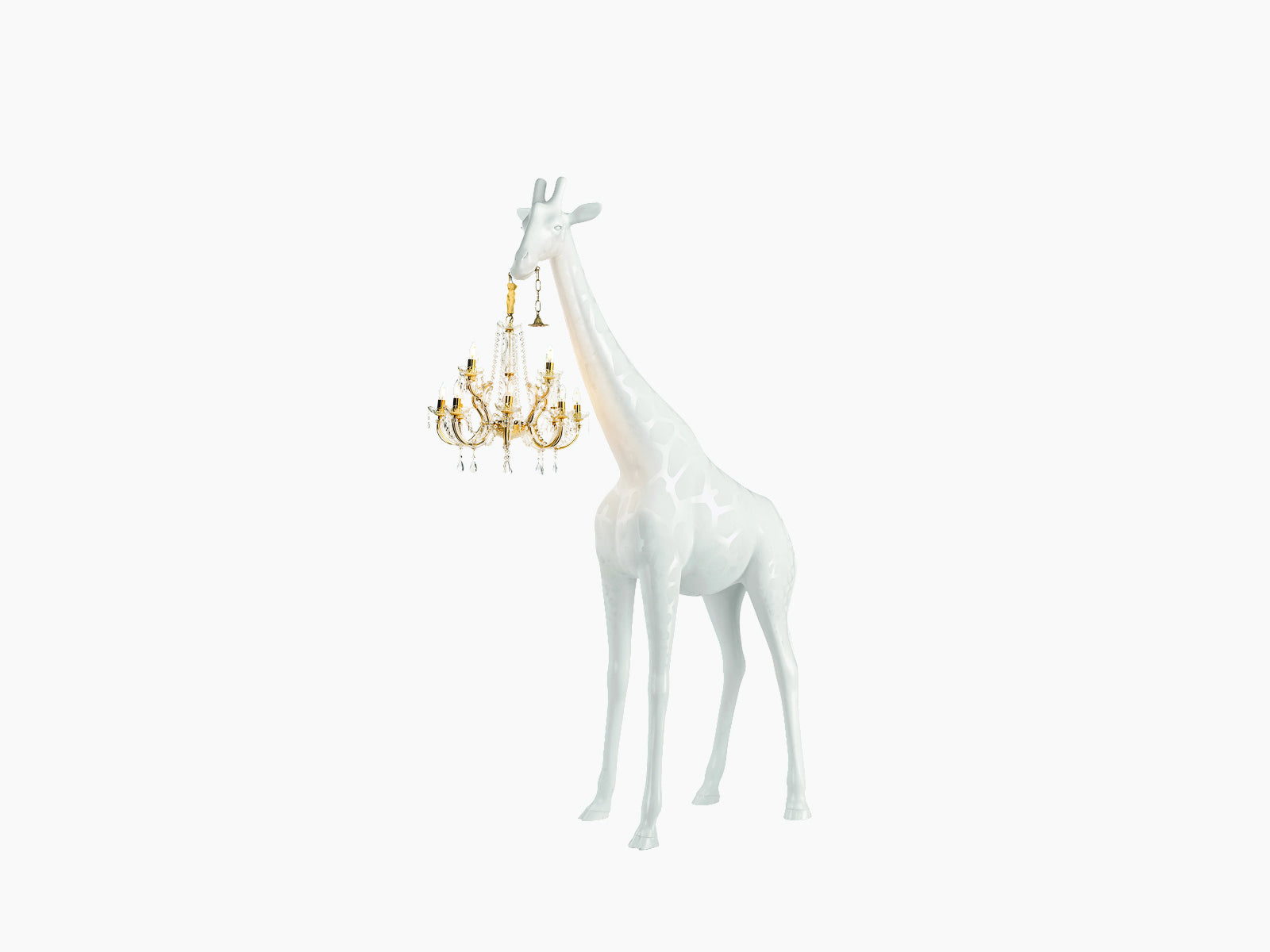 White Giraffe in Love XS sculpture with a gold crystal chandelier hanging from its neck against a white background.