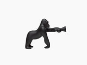 Kong XS black gorilla lamp with an adjustable arm and a lit light head