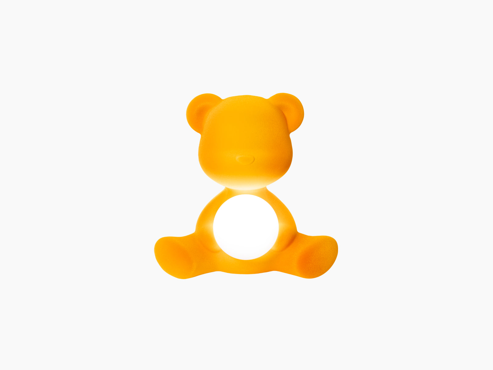 Velvet Dark Gold Teddy Girl LED Lamp in a seated pose with a glowing white orb in its lap