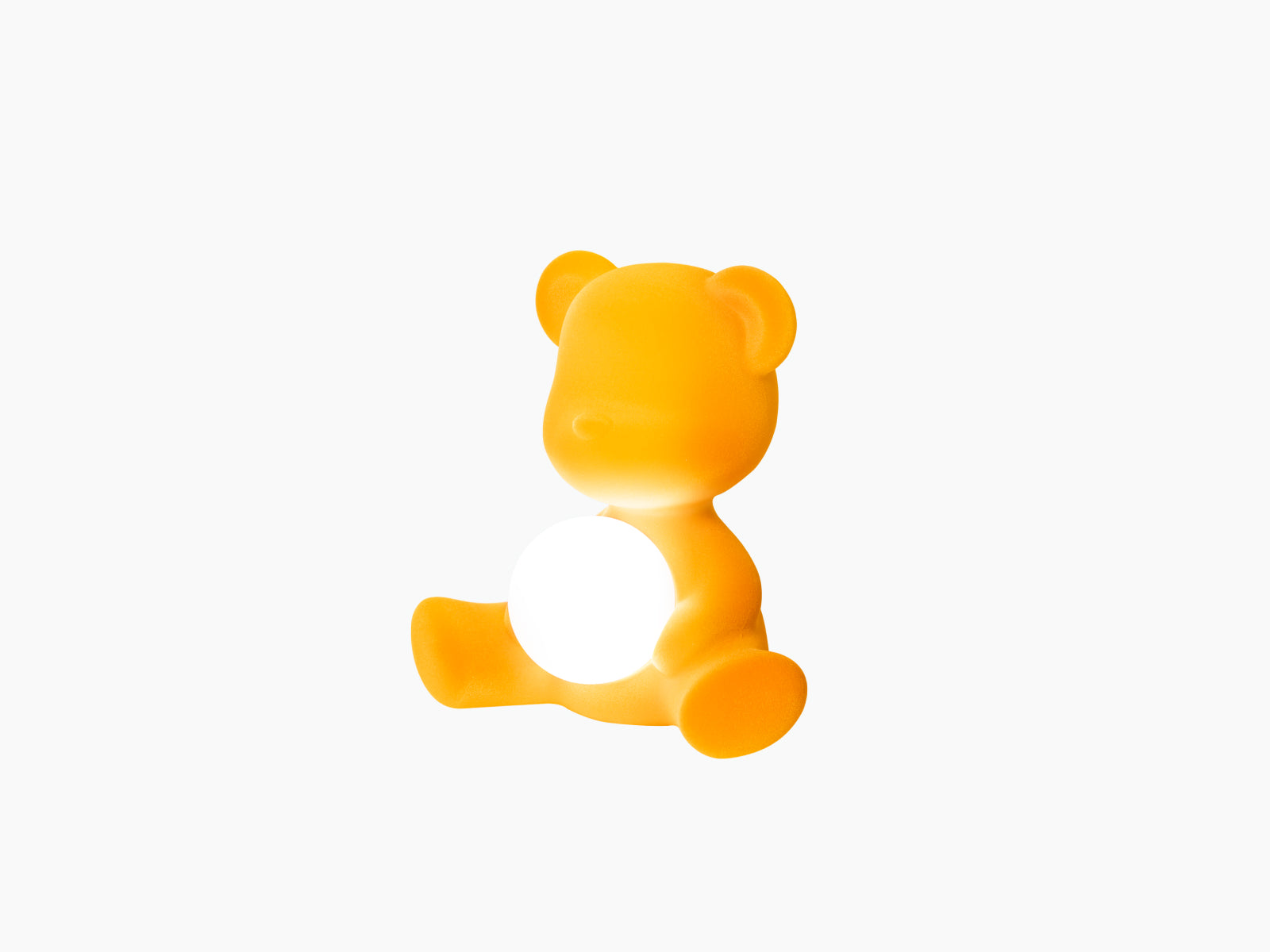 Teddy Girl LED lamp in Velvet Dark Gold viewed from the side with a white glowing orb.