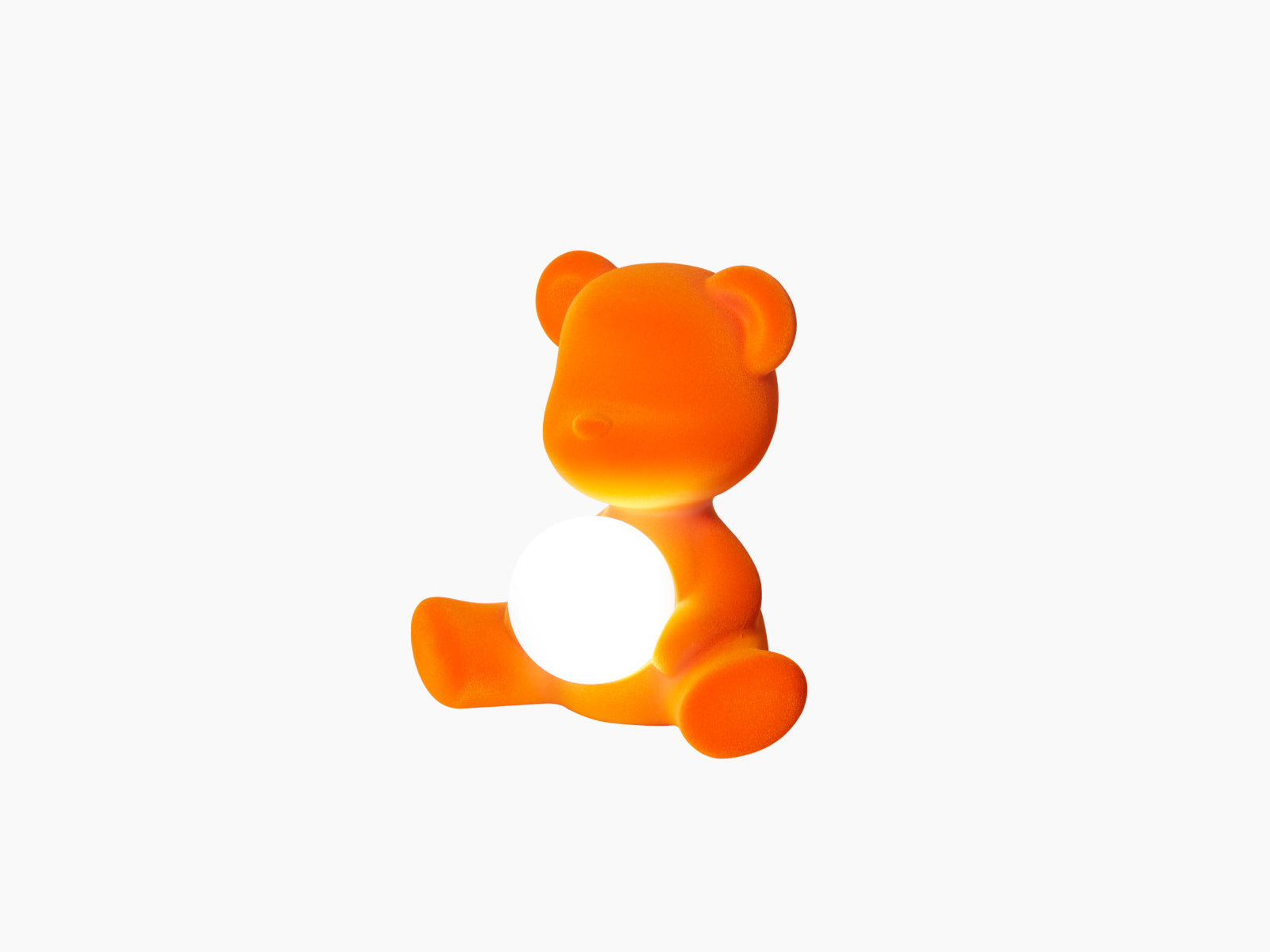 Another view of the orange Teddy Girl LED lamp holding a glowing white sphere.