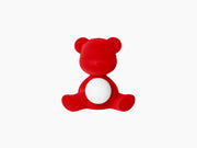 Velvet red Teddy Girl LED lamp embraces a glowing white sphere.