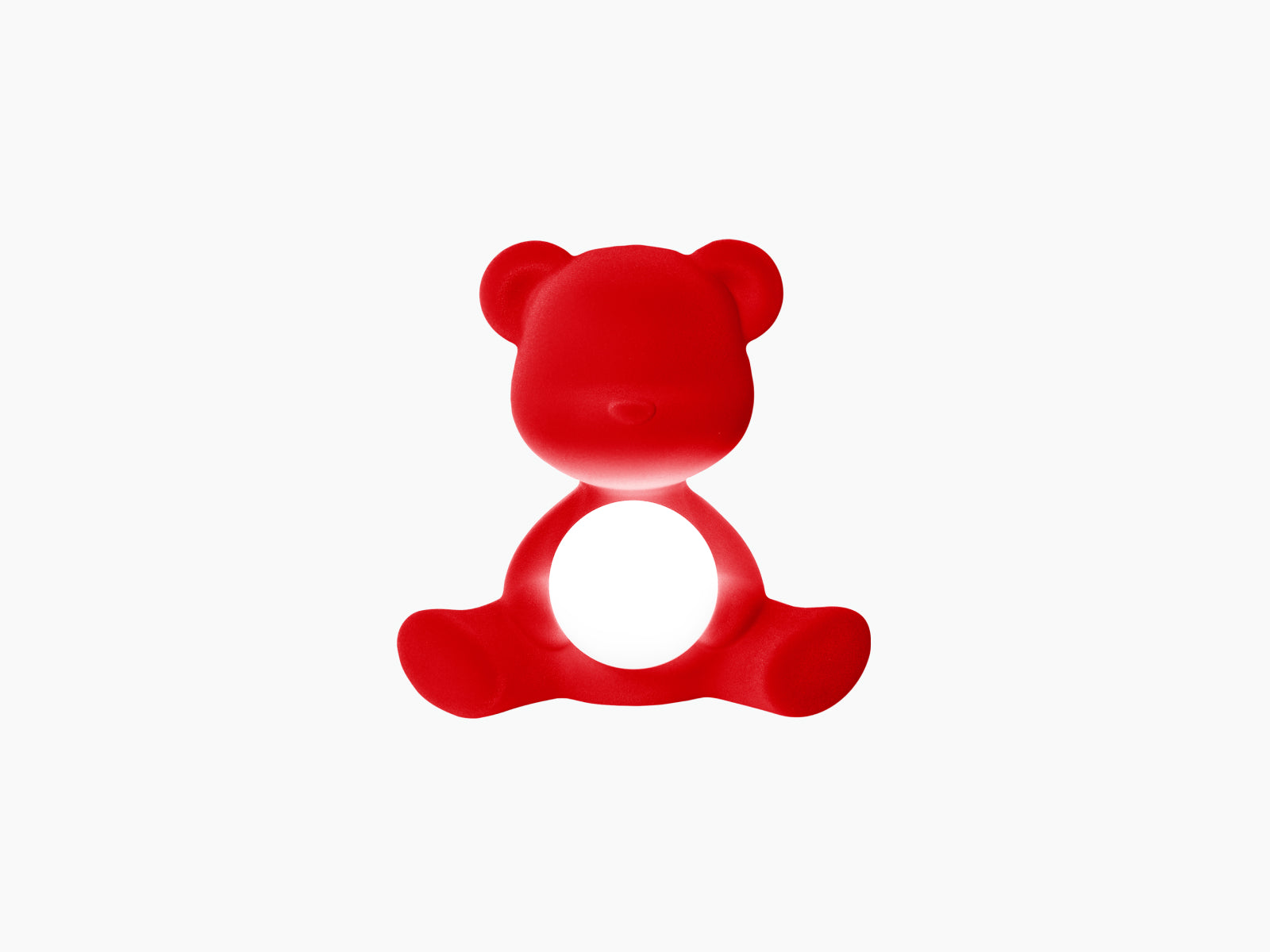 Velvet red Teddy Girl LED lamp seated with a glowing white sphere resting in its lap.