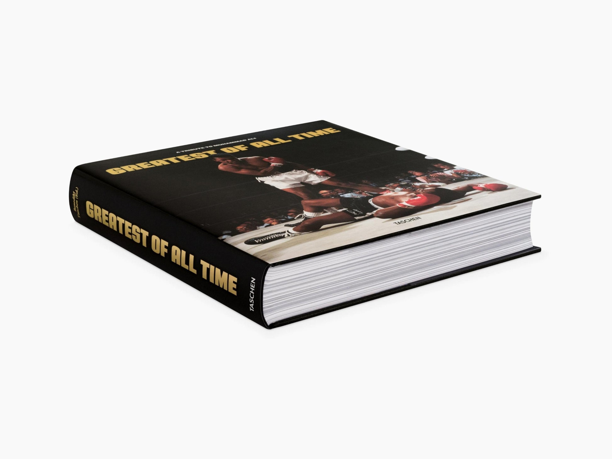Thick hardcover book with a black cover and gold Greatest of All Time title on the spine, featuring a boxing scene on the cover