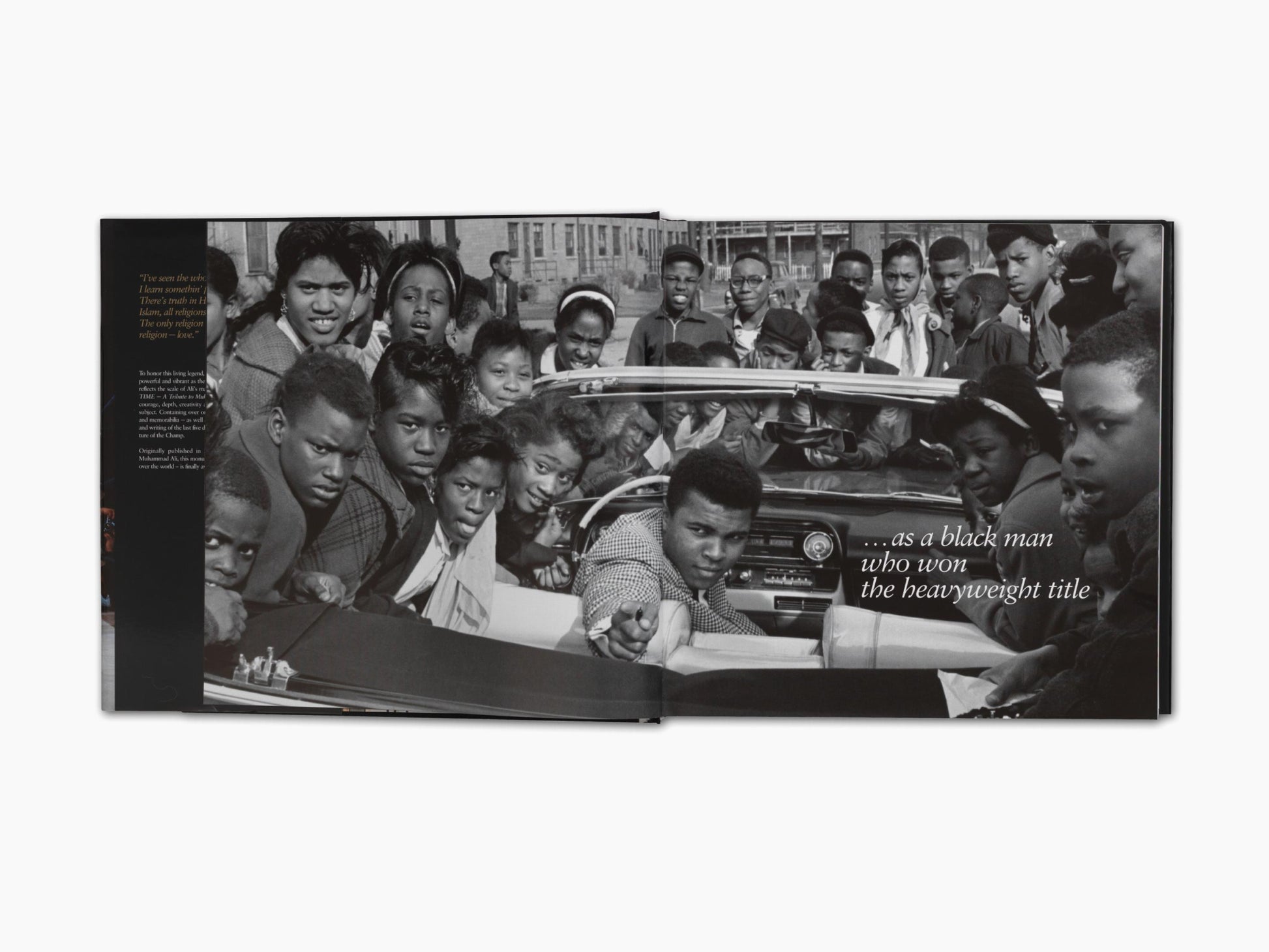 Black and white book spread showing a crowd around a car with the quote about a black man who won the heavyweight title.