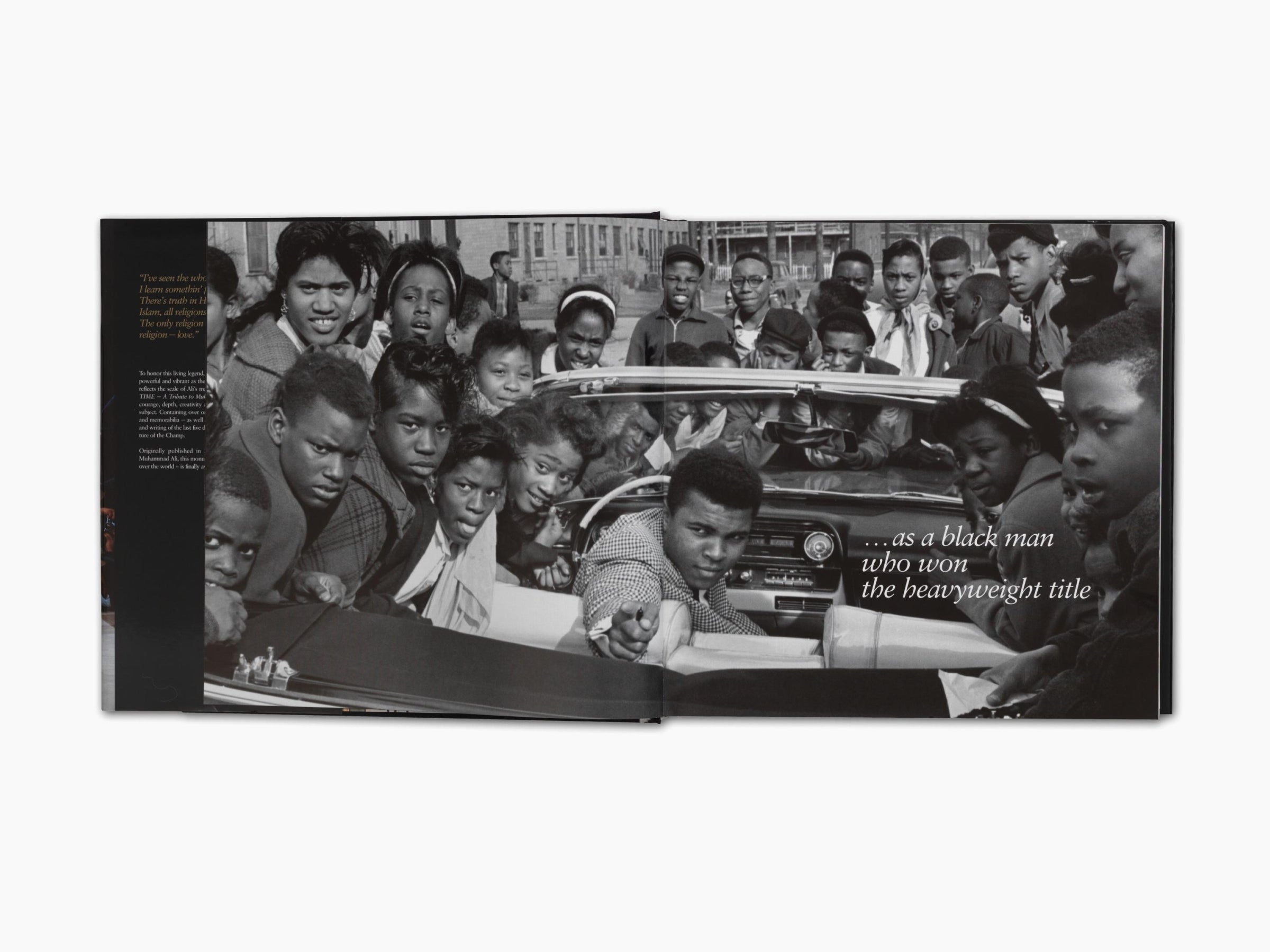 Black and white book spread showing a crowd around a car with the quote about a black man who won the heavyweight title.