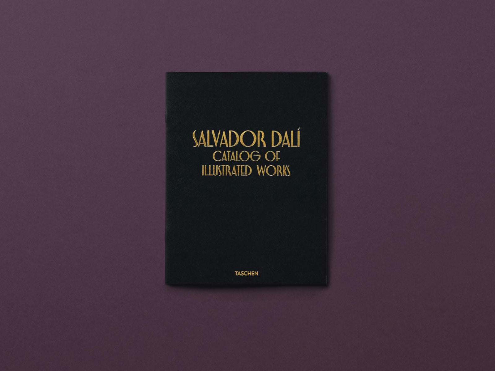 Salvador Dalí Catalog of Illustrated Works black cover with gold lettering from a TASCHEN edition.