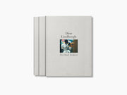 Two-volume Dior Lindbergh New York Archives book set with a small centered photo on a linen cover