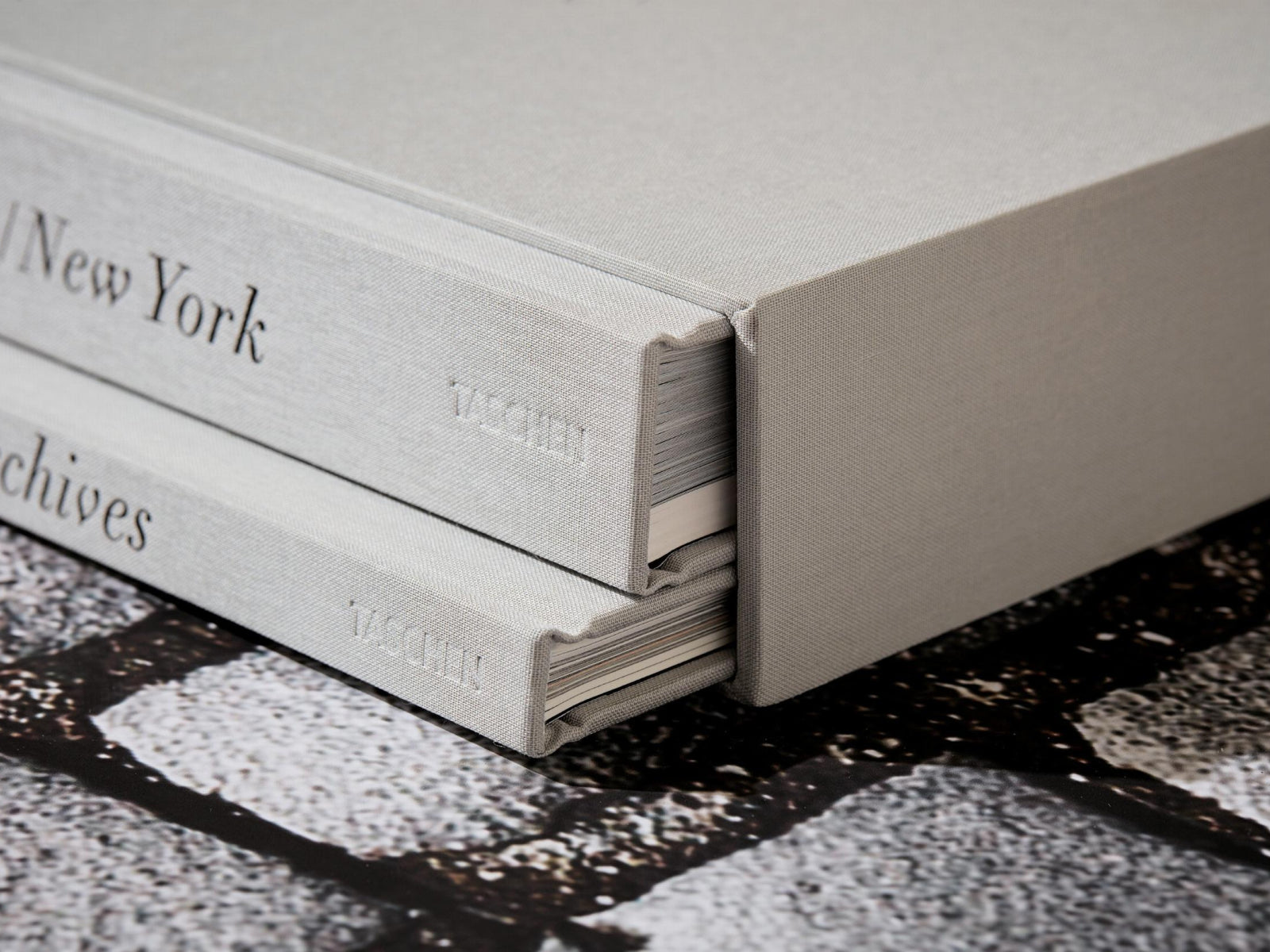 Two volume gray cloth bound photography books from the Peter Lindbergh Dior collection with a matching slipcase