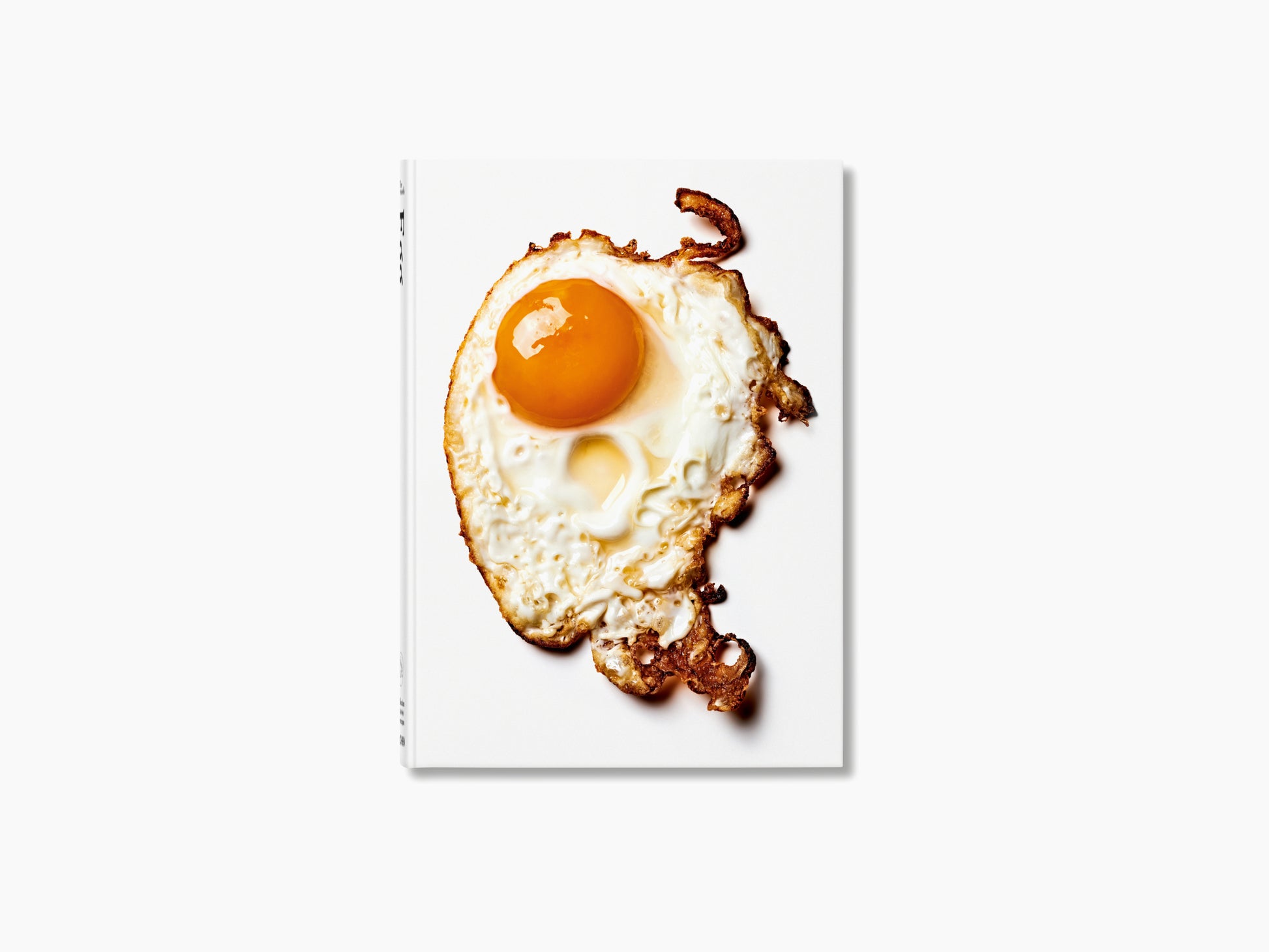 The Gourmand’s Egg book cover featuring a sunny side up egg on a white background with an orange backdrop
