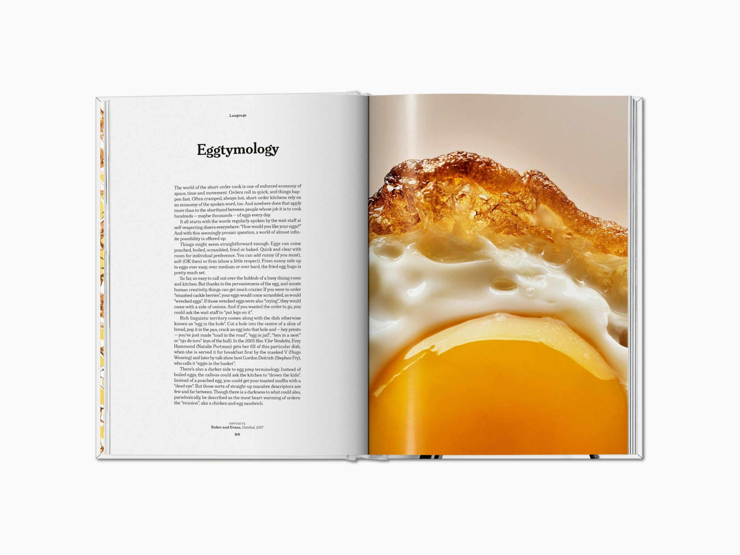 Close-up of a fried egg with a crispy edge and bright yolk on the right page, opposite text in a column titled Eggtology.