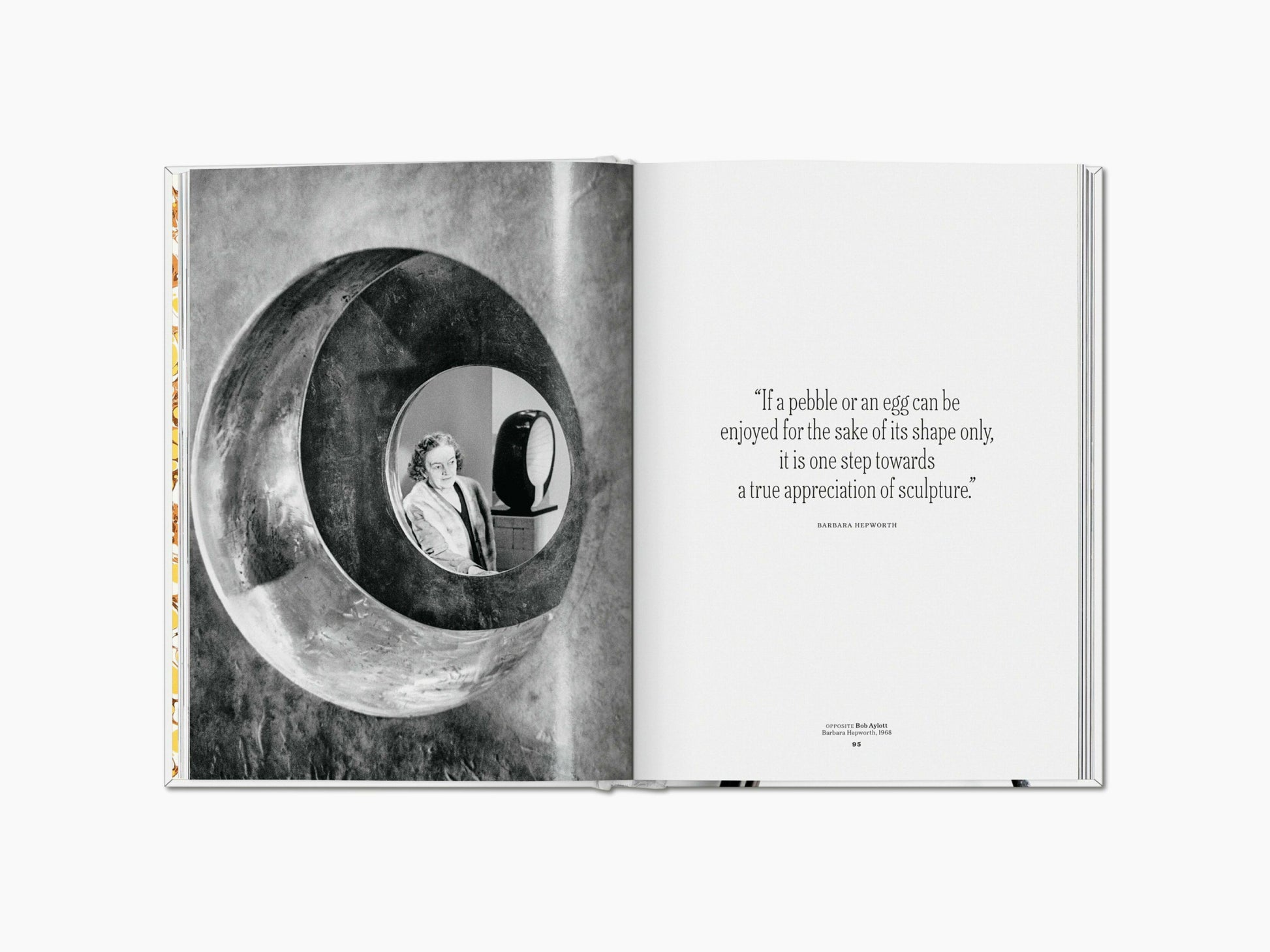 Two page spread features a black and white photograph of a circular sculpture with a figure inside, beside a quote about sculpture.