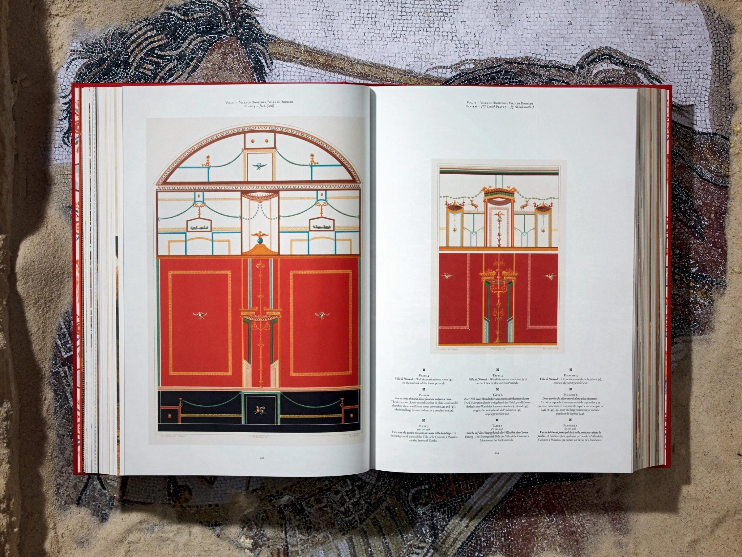 Open spread from Fausto & Felice Niccolini Pompeii volume featuring bold orange interior panels and decorative border motifs.