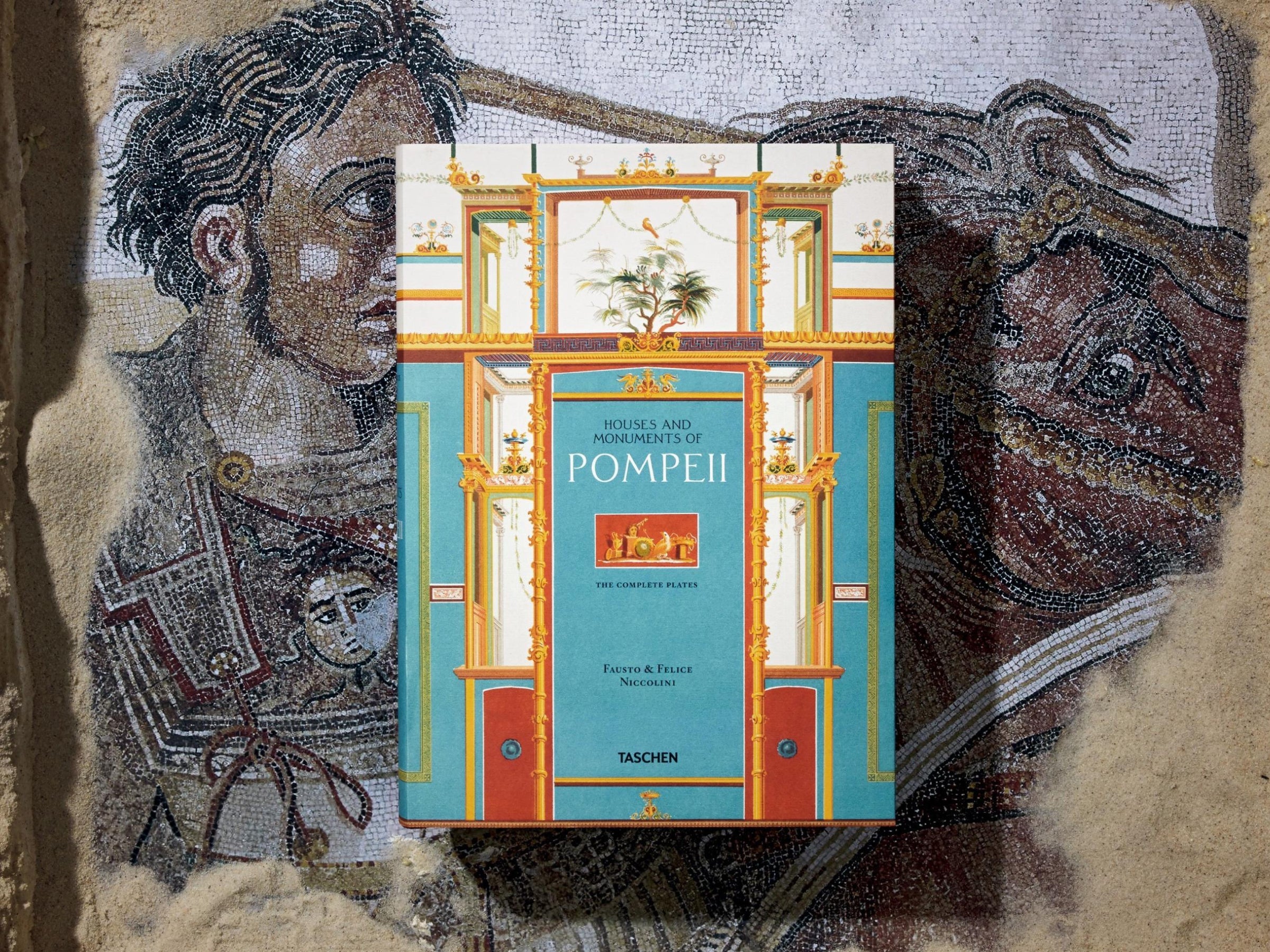 Colorful book cover for Pompeii volumes with turquoise central panel and ornate architectural framing.