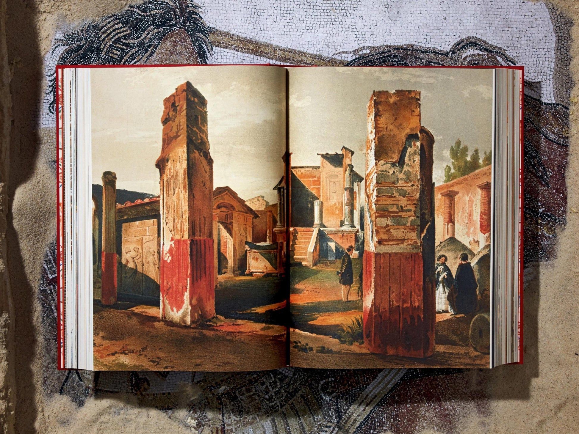 Open book spread displaying color lithographs of Pompeii with tall columns and ancient architecture