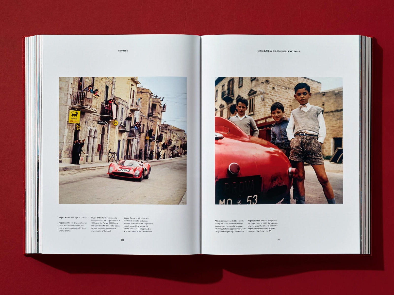 Left page shows a red Ferrari race car on a narrow town street with spectators, right page shows three boys posing beside a red car.