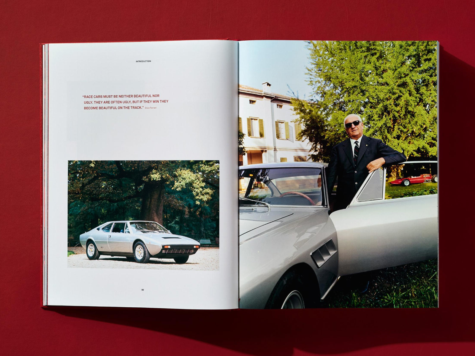 Ferrari book spread shows a silver vintage coupe in a park on the left and a man by a silver sports car on the right.