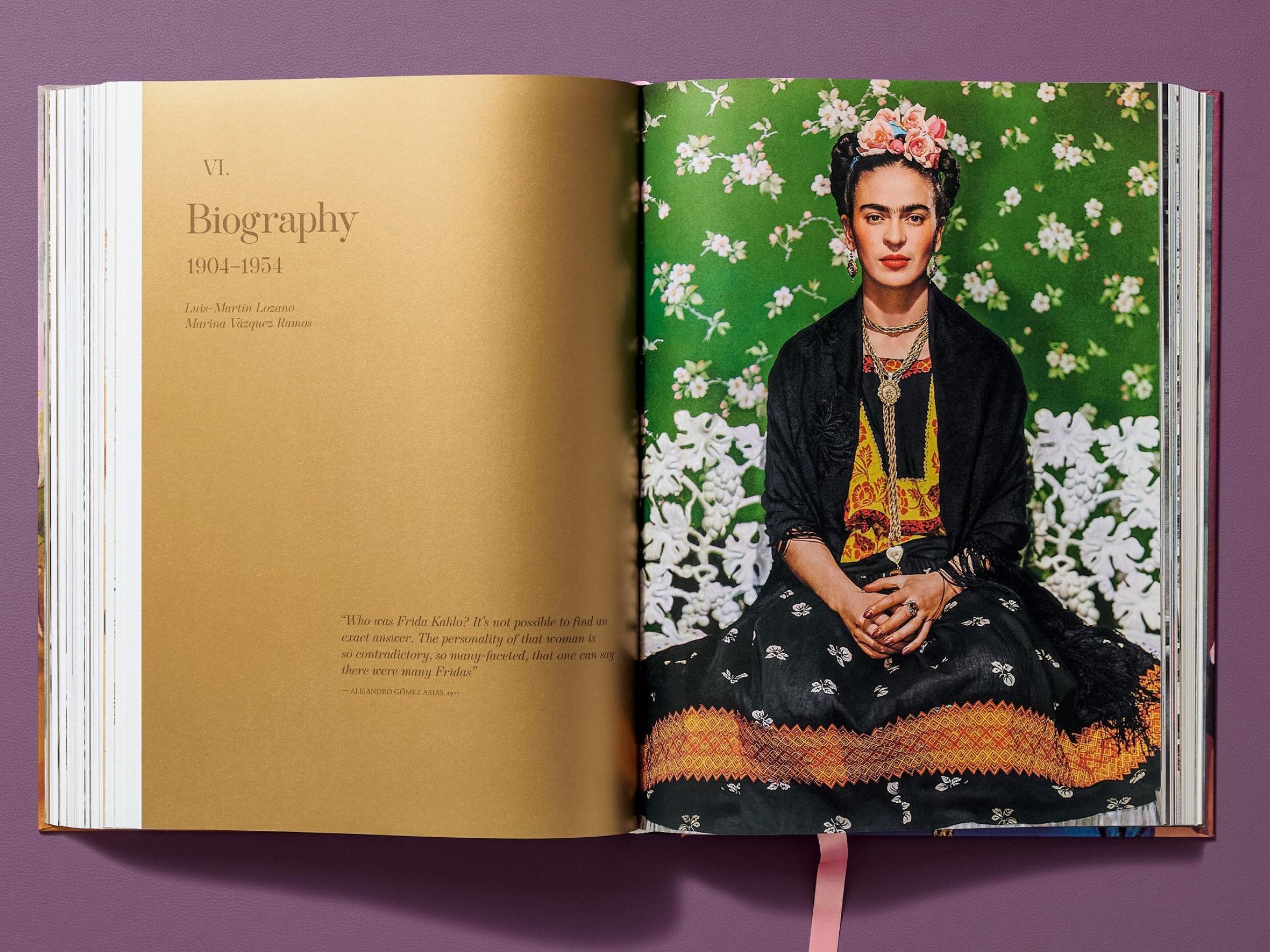 Frida Kahlo seated in a green patterned dress with a floral headpiece, set against a bright green floral backdrop